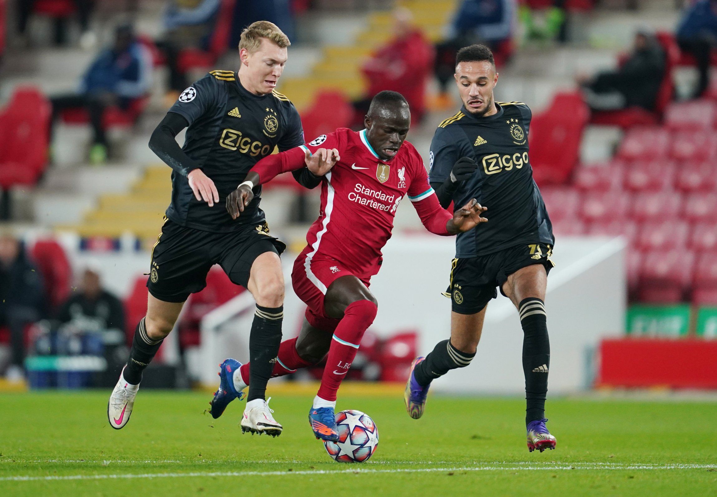 Ajax defender Noussair Mazraoui in action against Liverpool's Sadio Mane in the Champions League