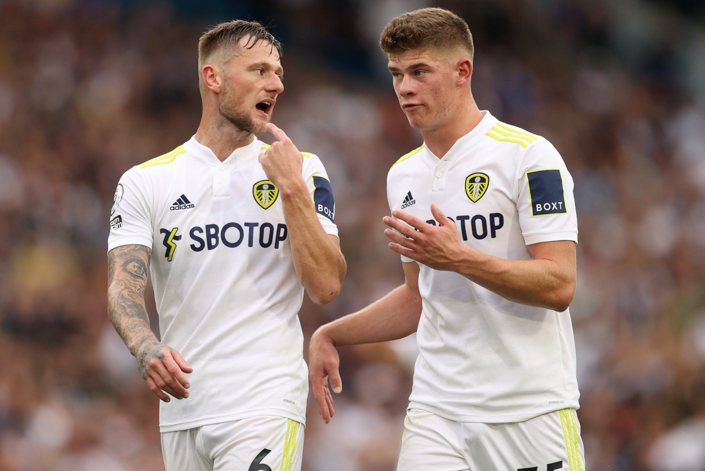 Leeds United youngster Charlie Cresswell alongside captain Liam Cooper against West Ham United in the Premier League