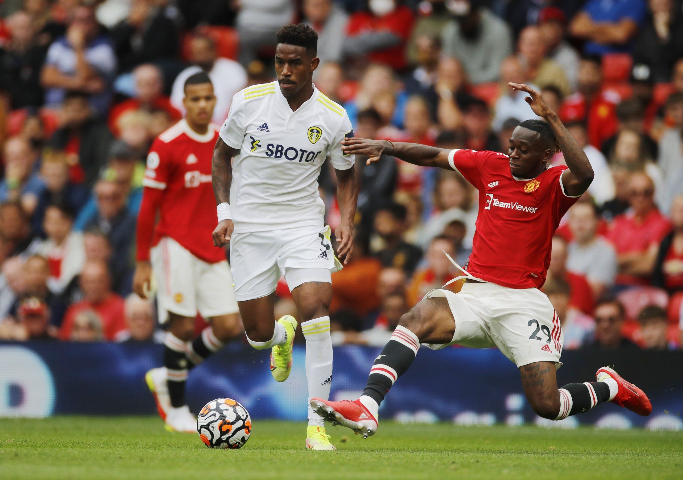 Leeds United's Junior Firpo battles Manchester United's Aaron Wan-Bissaka