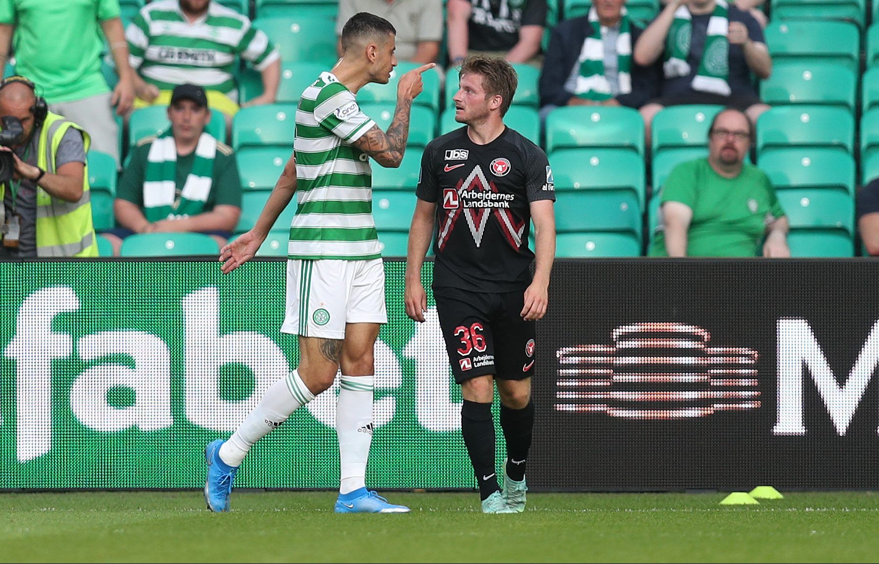 Soccer Football - Champions League - Second Qualifying Round - Celtic v FC Midtjylland - Celtic Park, Glasgow, Scotland, Britain - July 20, 2021  Celtic's Nir Bitton clashes with FC Midtjylland's Anders Dreyer before being shown a red card by referee REUTERS/Russell Cheyne