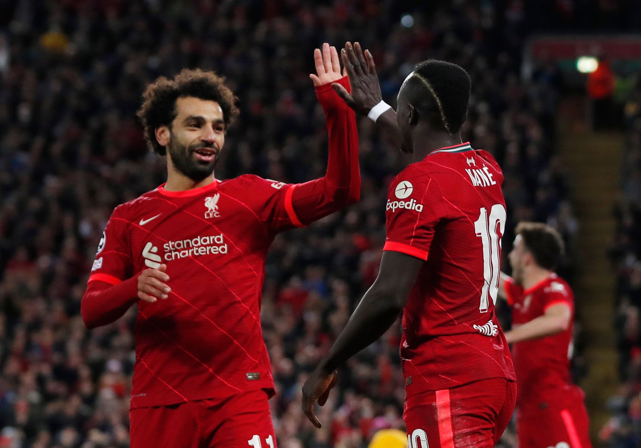 Soccer Football - Champions League - Group B - Liverpool v Atletico Madrid - Anfield, Liverpool, Britain - November 3, 2021 Liverpool's Sadio Mane celebrates scoring their second goal with Mohamed Salah Action Images via Reuters/Lee Smith