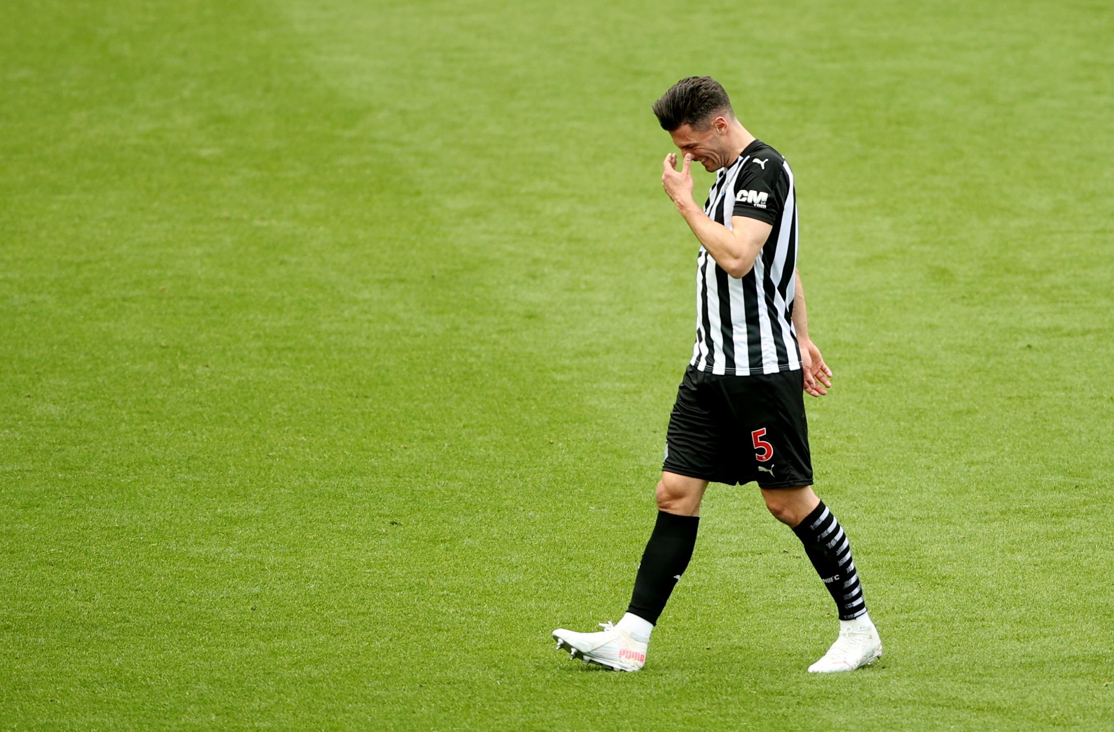 Soccer Football - Premier League - Newcastle United v Arsenal - St James' Park, Newcastle, Britain - May 2, 2021 Newcastle United's Fabian Schar walks off the pitch after a red card Pool via REUTERS/Molly Darlington EDITORIAL USE ONLY. No use with unauthorized audio, video, data, fixture lists, club/league logos or 'live' services. Online in-match use limited to 75 images, no video emulation. No use in betting, games or single club /league/player publications.  Please contact your account repres
