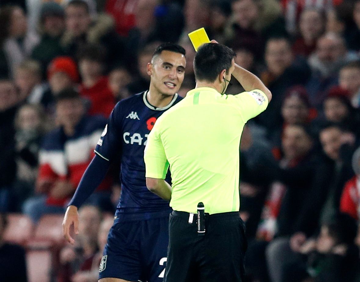 Soccer Football - Premier League - Southampton v Aston Villa - St Mary's Stadium, Southampton, Britain - November 5, 2021  Aston Villa's Anwar El Ghazi is shown a yellow card by referee Andy Madley REUTERS/Peter Nicholls EDITORIAL USE ONLY. No use with unauthorized audio, video, data, fixture lists, club/league logos or 'live' services. Online in-match use limited to 75 images, no video emulation. No use in betting, games or single club /league/player publications.  Please contact your account r