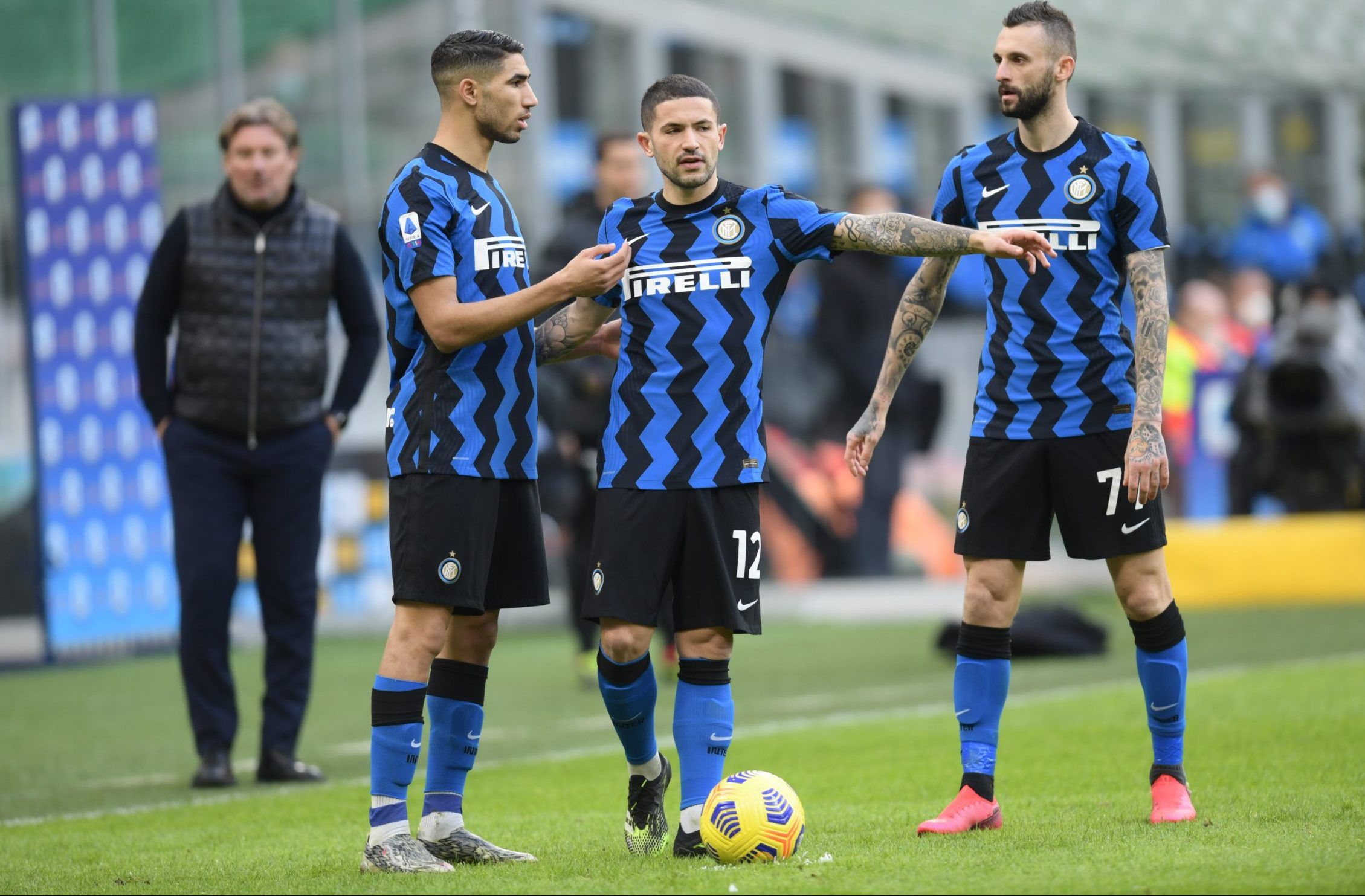 Inter Milan midfielder Stefano Sensi looks on with teammates