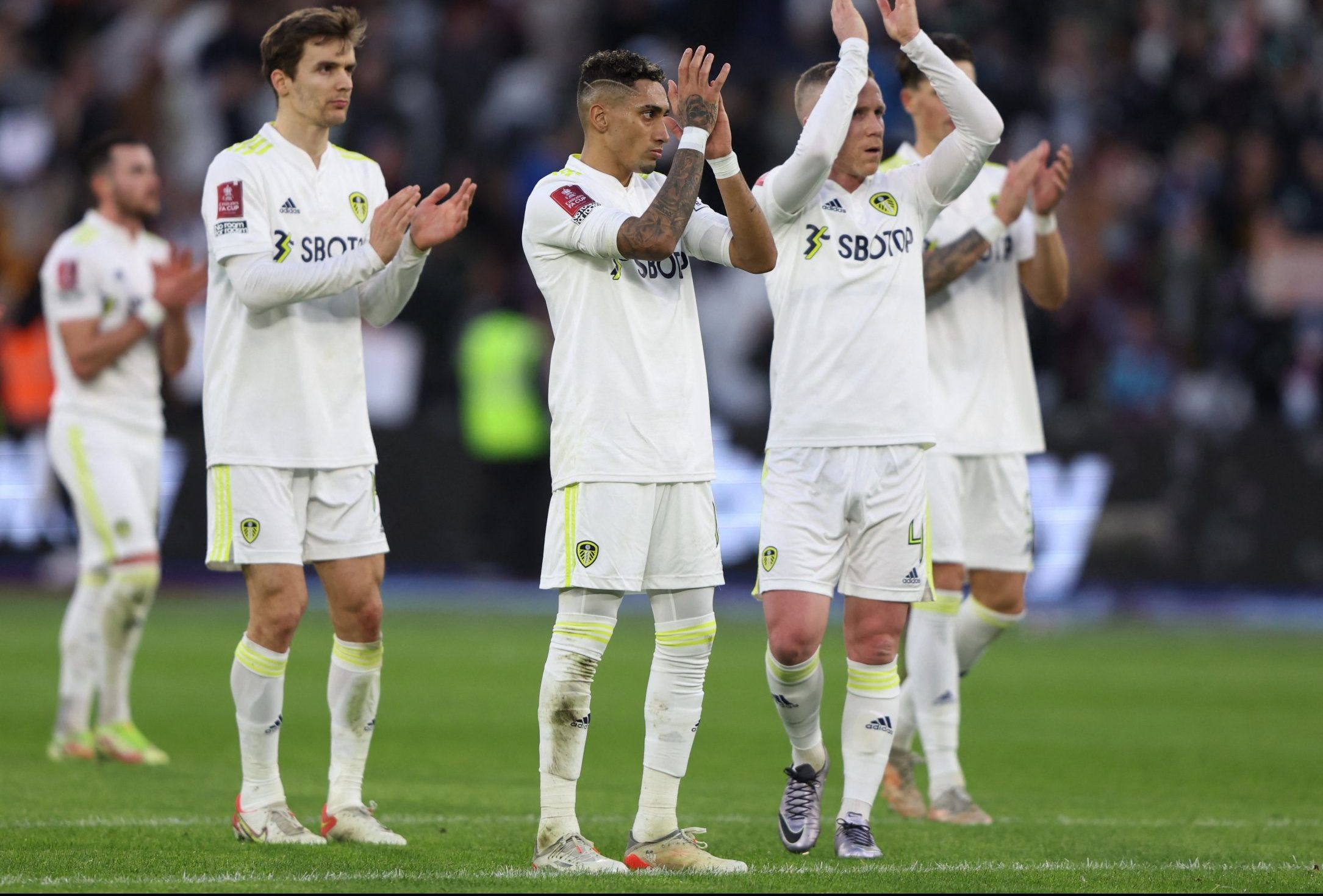 Leeds United players applaud supporters after FA Cup defeat to West Ham