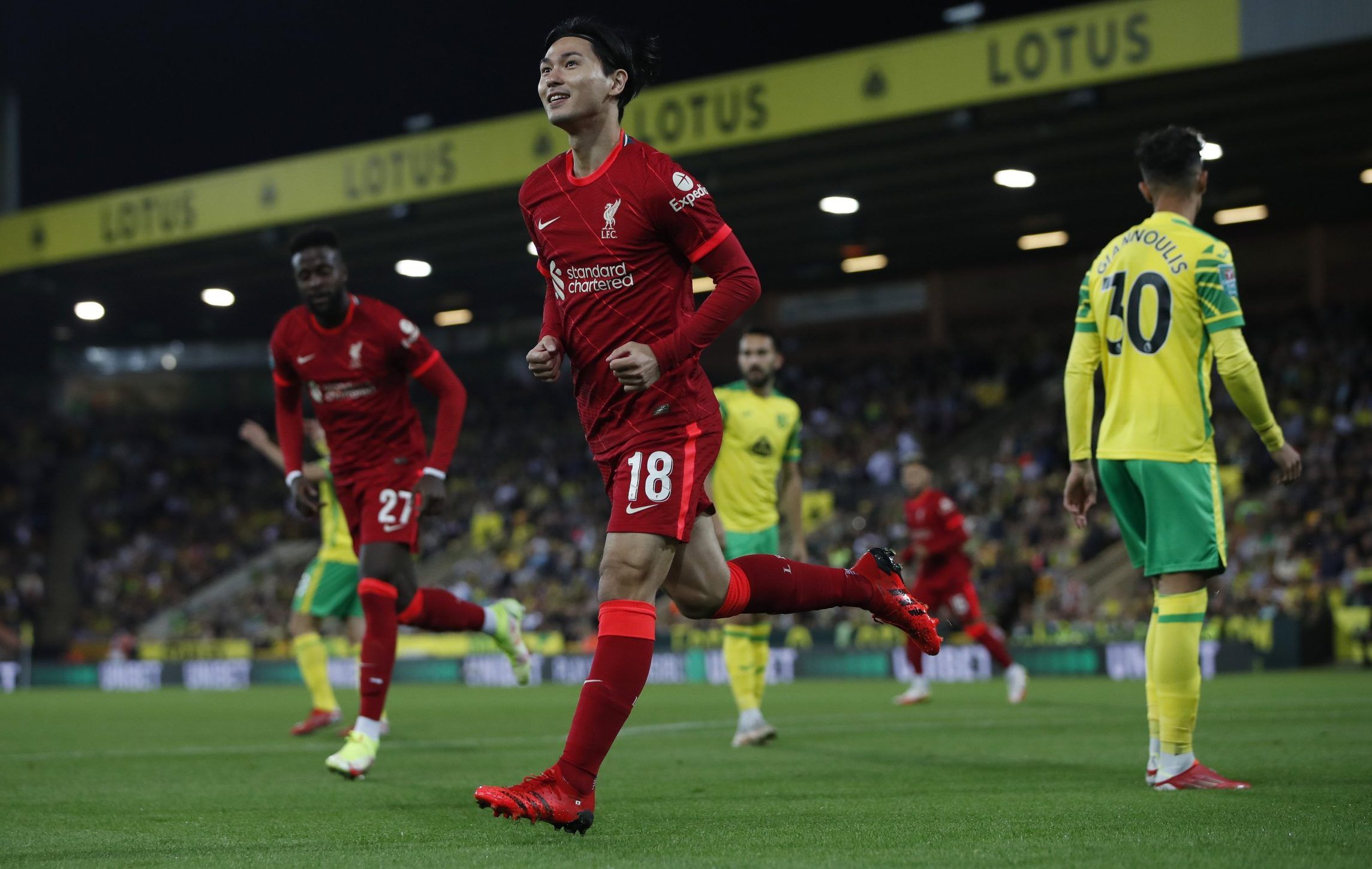 Liverpool forward Takumi Minamino celebrates scoring against Norwich City in the Carabao Cup