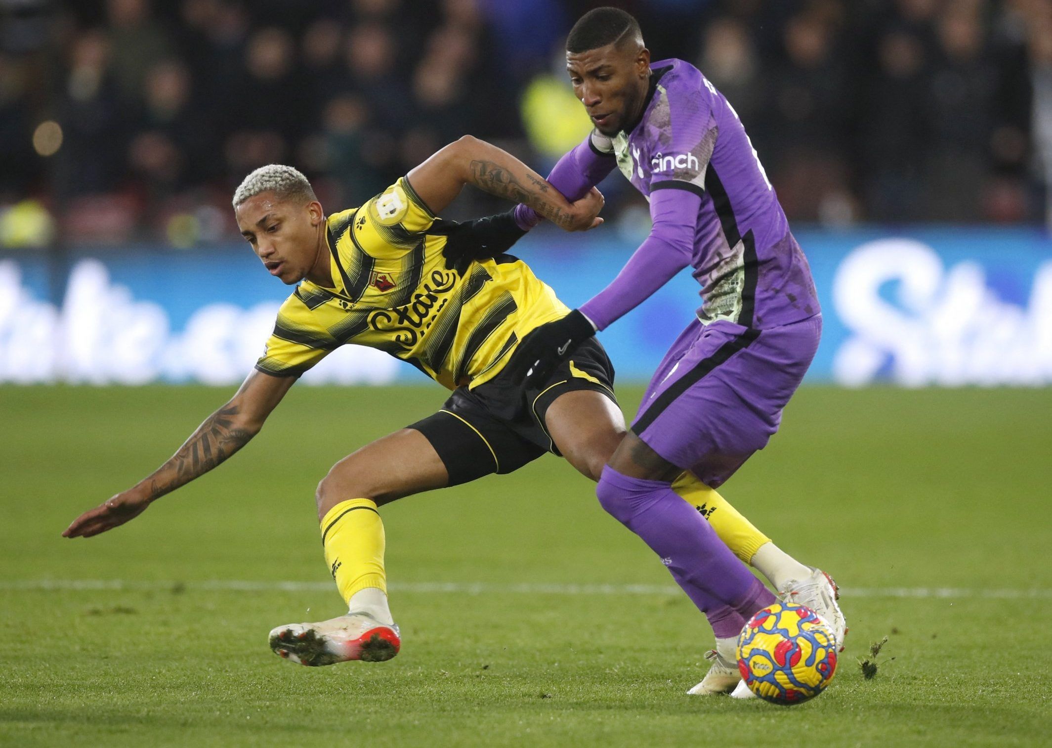 Spurs defender Emerson Royal battles Watford's Joao Pedro in their Premier League clash at Vicarage Road