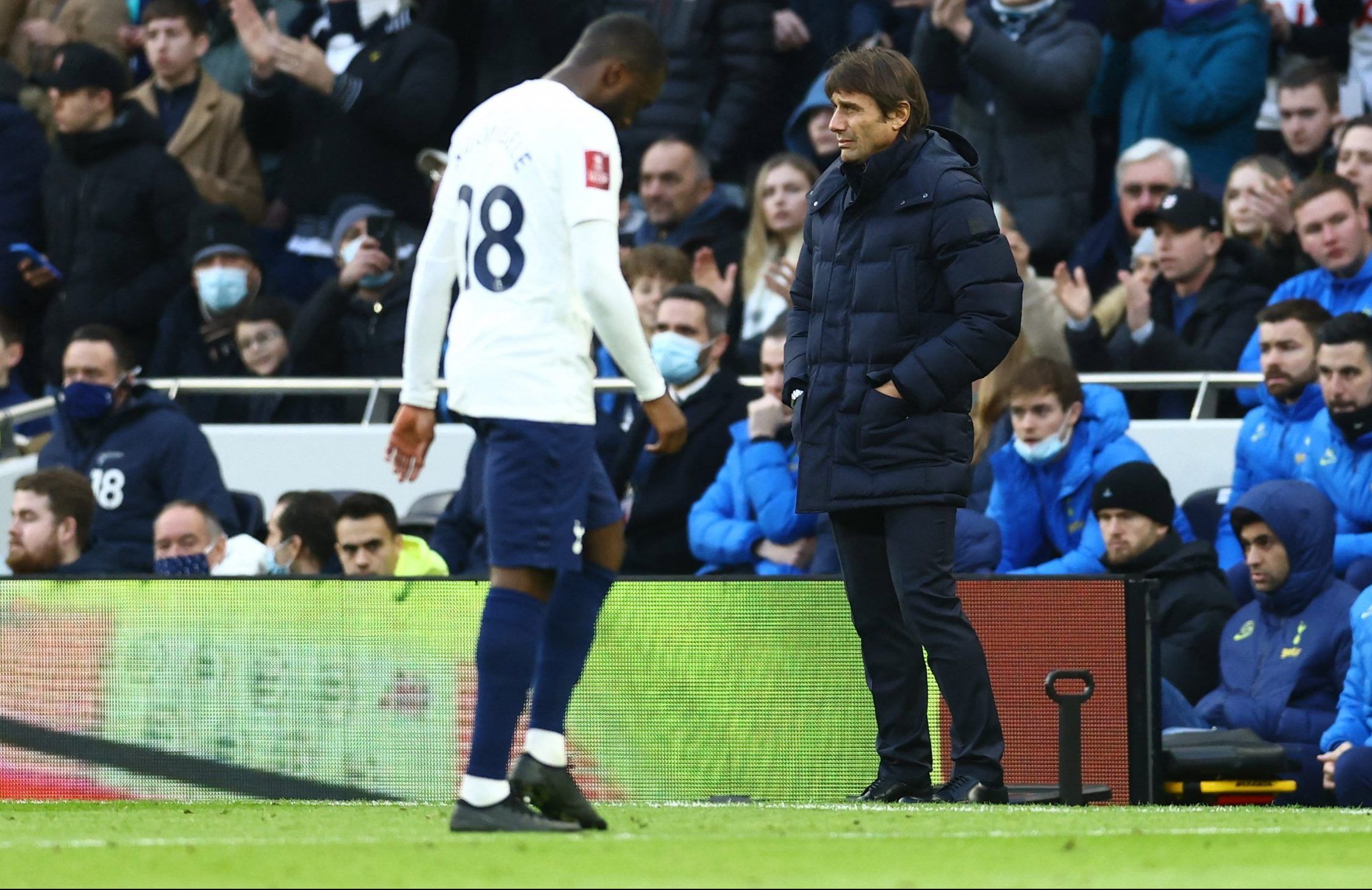 Spurs midfielder Tanguy Ndombele walks off after being substituted by Antonio Conte