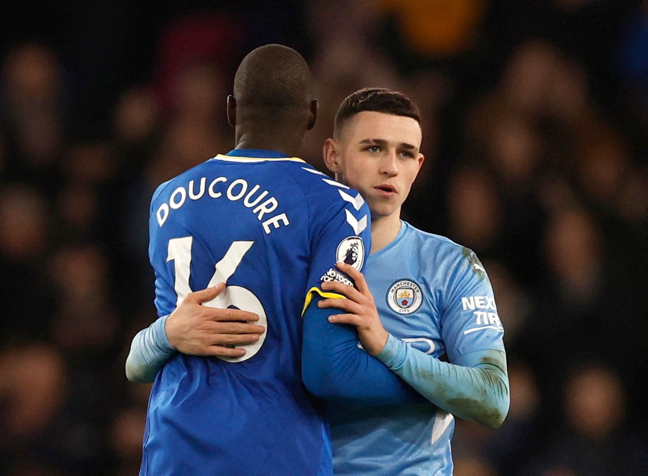 Soccer Football - Premier League - Everton v Manchester City - Goodison Park, Liverpool, Britain - February 26, 2022 Everton's Abdoulaye Doucoure and Manchester City's Phil Foden after the match Action Images via Reuters/Jason Cairnduff EDITORIAL USE ONLY. No use with unauthorized audio, video, data, fixture lists, club/league logos or 'live' services. Online in-match use limited to 75 images, no video emulation. No use in betting, games or single club /league/player publications.  Please contac