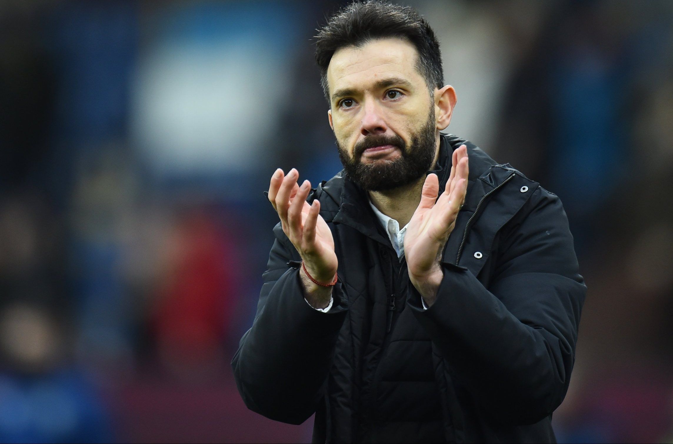 Huddersfield Town boss Carlos Corberan claps fans after FA Cup game vs Burnley