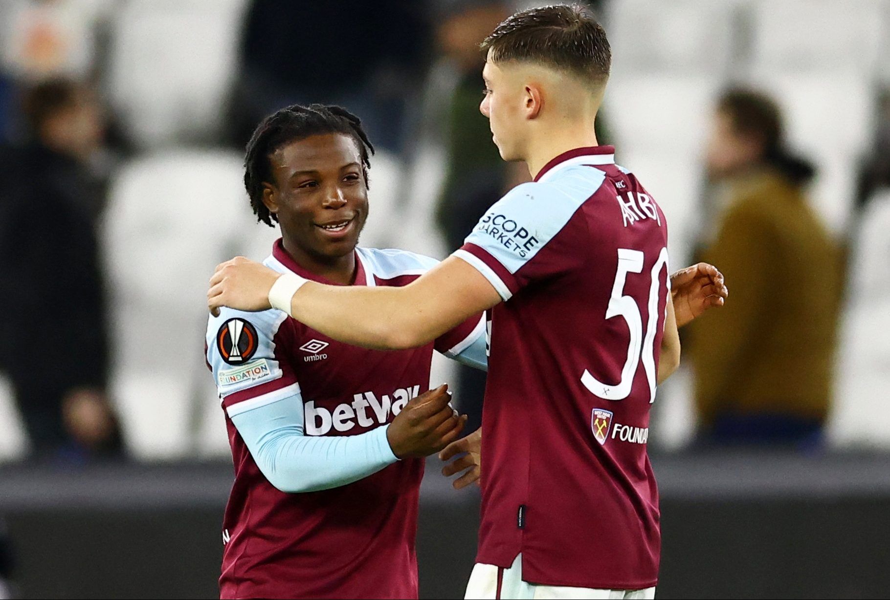 Soccer Football - Europa League - Group H - West Ham United v Dinamo Zagreb - London Stadium, London, Britain - December 9, 2021  West Ham United's Harrison Ashby celebrates with Keenan Forson as West Ham United qualify for the knock out stages REUTERS/David Klein