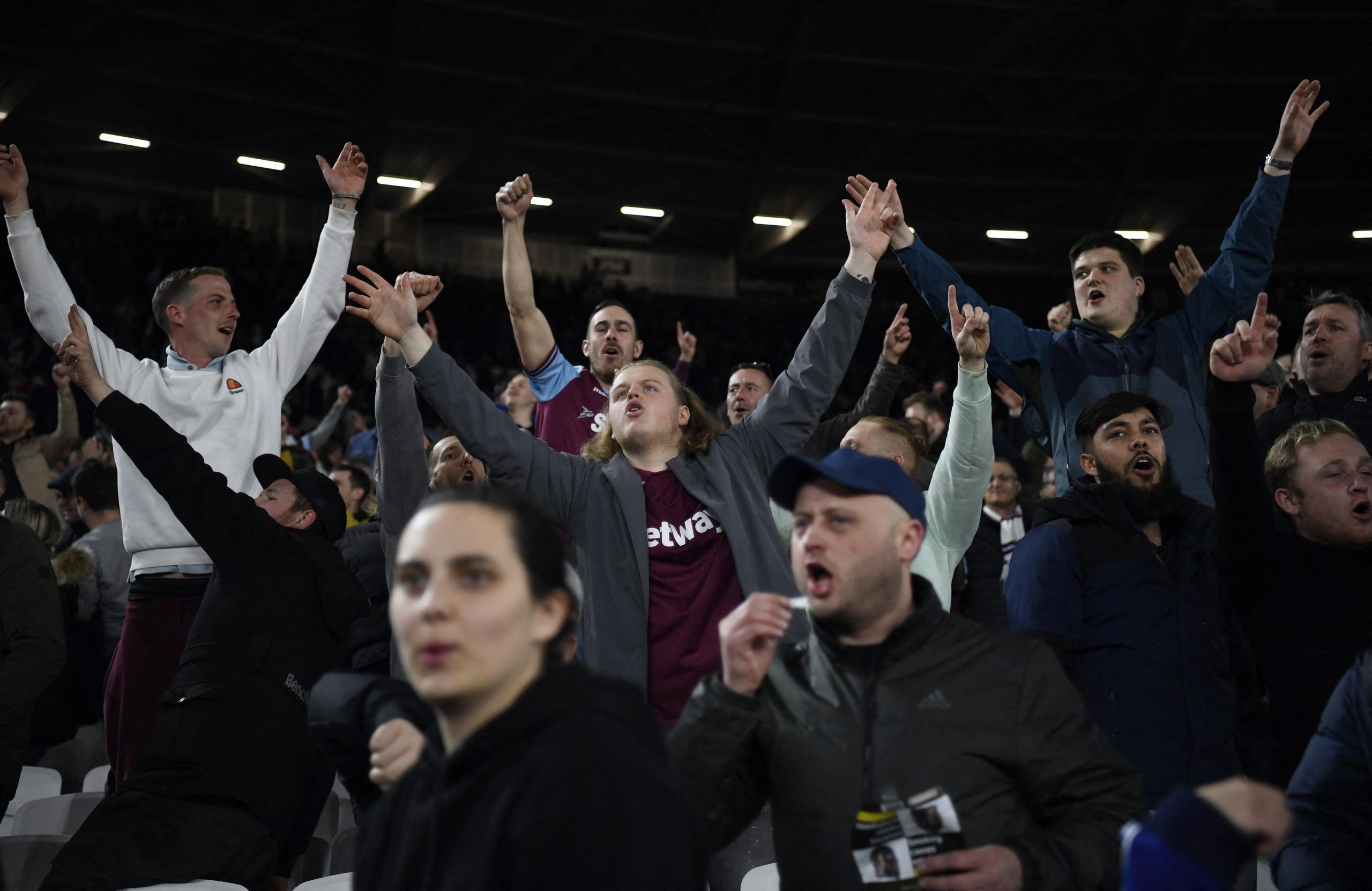 Soccer Football - Europa League - Round of 16 Second Leg - West Ham United v Sevilla - London Stadium, London, Britain - March 17, 2022  West Ham United fans celebrate in the stands after the match REUTERS/Tony Obrien