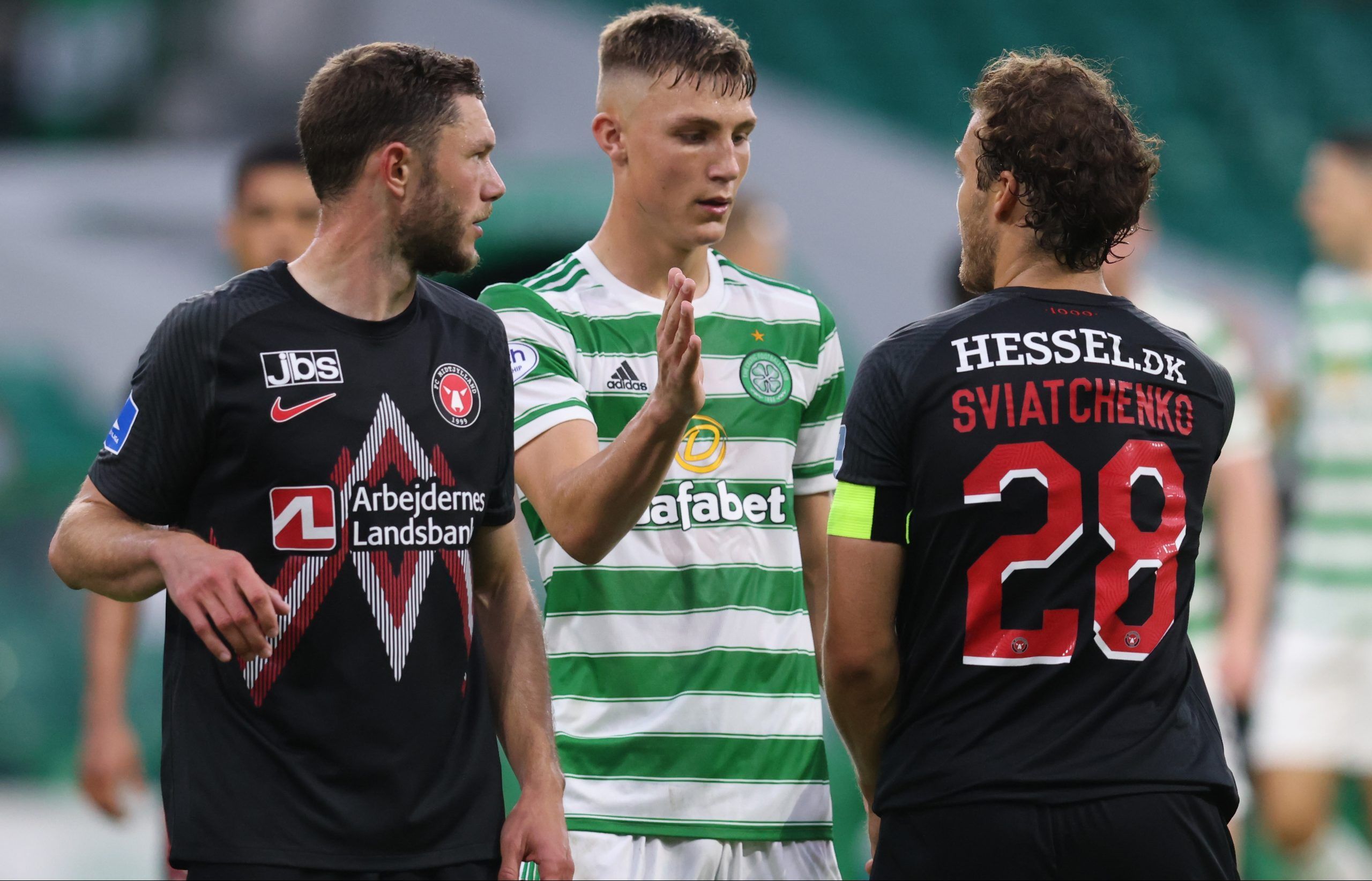 Soccer Football - Champions League - Second Qualifying Round - Celtic v FC Midtjylland - Celtic Park, Glasgow, Scotland, Britain - July 20, 2021  Celtic's Dane Murray with FC Midtjylland's Erik Sviatchenko after the match REUTERS/Russell Cheyne