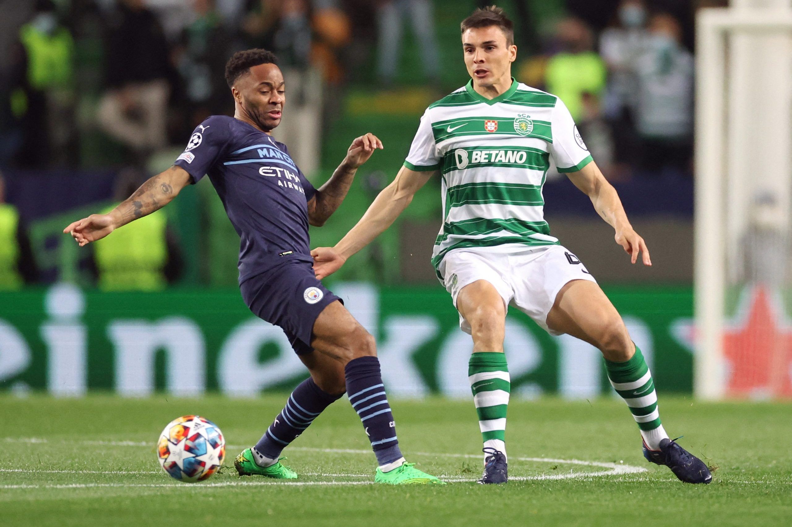 Soccer Football - Champions League - Round of 16 First Leg - Sporting CP v Manchester City - Estadio Jose Alvalade, Lisbon, Portugal - February 15, 2022 Manchester City's Raheem Sterling in action with Sporting CP's Joao Palhinha Action Images via Reuters/Carl Recine