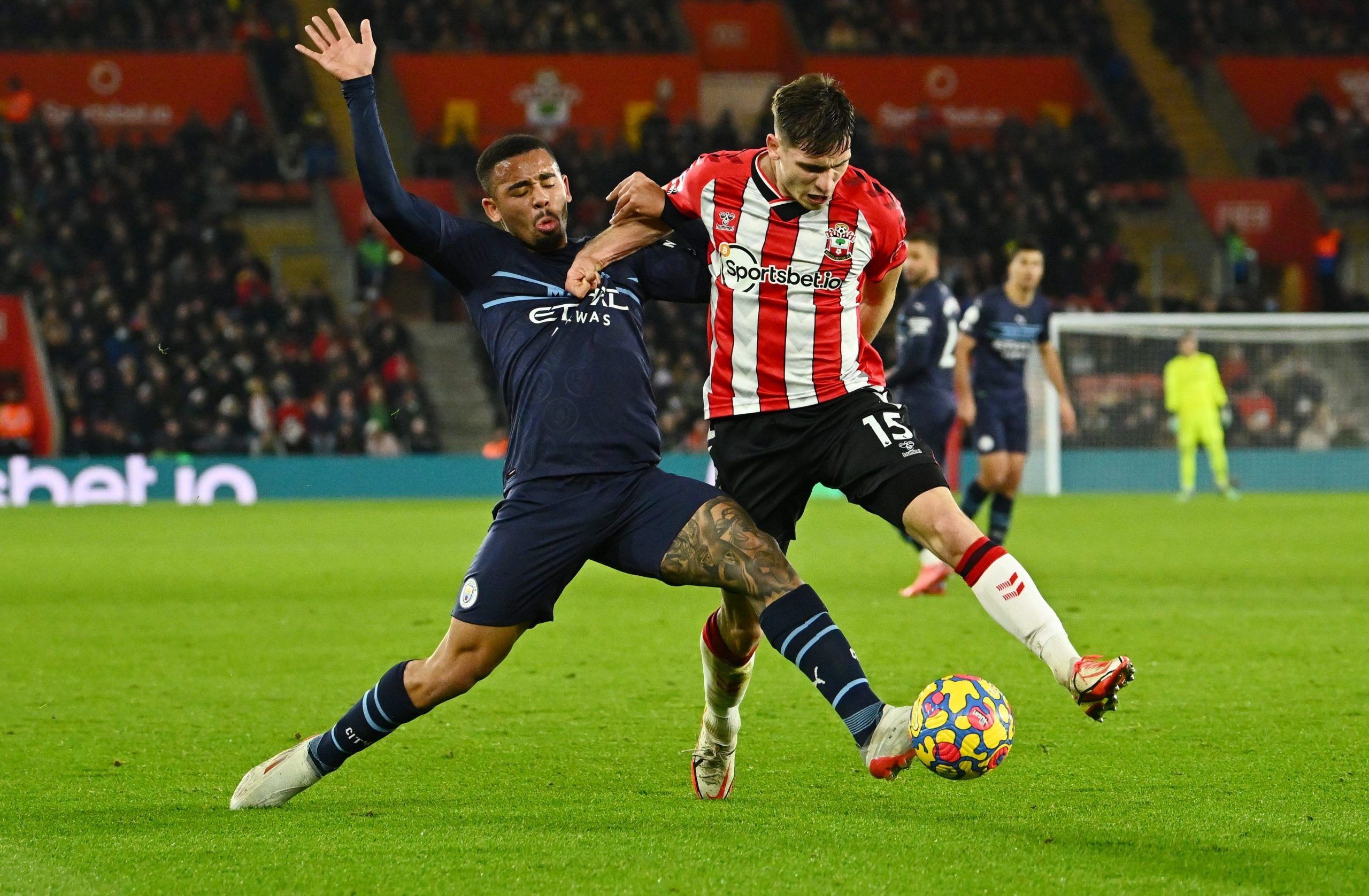 Soccer Football - Premier League - Southampton v Manchester City - St Mary's Stadium, Southampton, Britain - January 22, 2022 Manchester City's Gabriel Jesus in action with Southampton's Romain Perraud REUTERS/Dylan Martinez EDITORIAL USE ONLY. No use with unauthorized audio, video, data, fixture lists, club/league logos or 'live' services. Online in-match use limited to 75 images, no video emulation. No use in betting, games or single club /league/player publications.  Please contact your accou