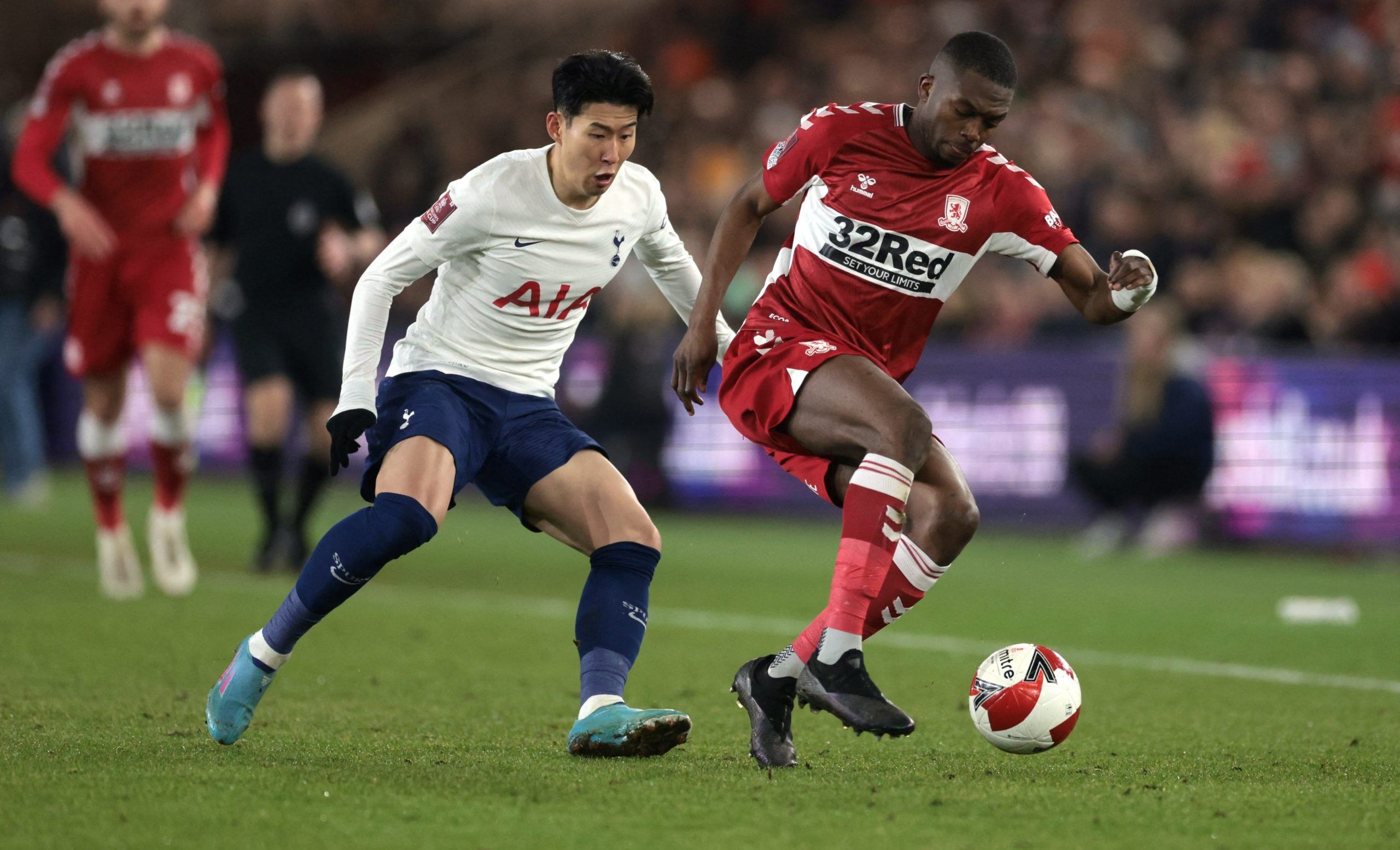 Soccer Football - FA Cup Fifth Round - Middlesbrough v Tottenham Hotspur - Riverside Stadium, Middlesbrough, Britain - March 1, 2022 Middlesbrough's Anfernee Dijksteel in action with Tottenham Hotspur's Son Heung-min Action Images via Reuters/Lee Smith