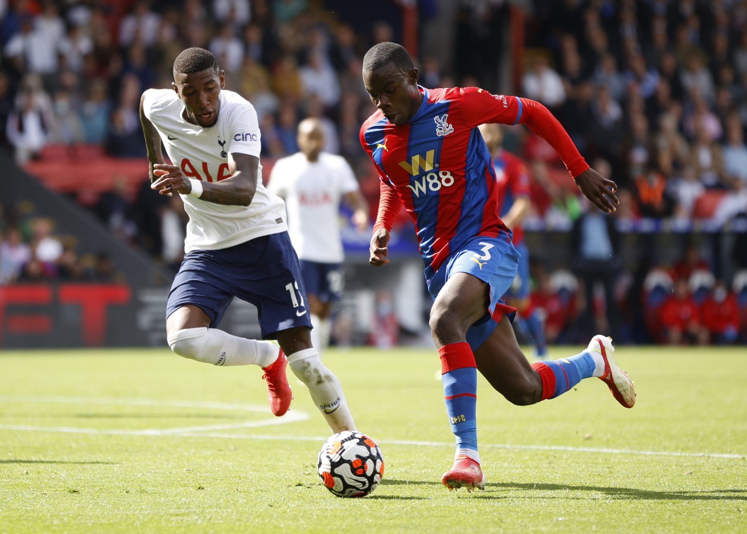 Soccer Football - Premier League - Crystal Palace v Tottenham Hotspur - Selhurst Park, London, Britain - September 11, 2021 Crystal Palace's Tyrick Mitchell in action with Tottenham Hotspur's Emerson Royal Action Images via Reuters/John Sibley EDITORIAL USE ONLY. No use with unauthorized audio, video, data, fixture lists, club/league logos or 'live' services. Online in-match use limited to 75 images, no video emulation. No use in betting, games or single club /league/player publications.  Please