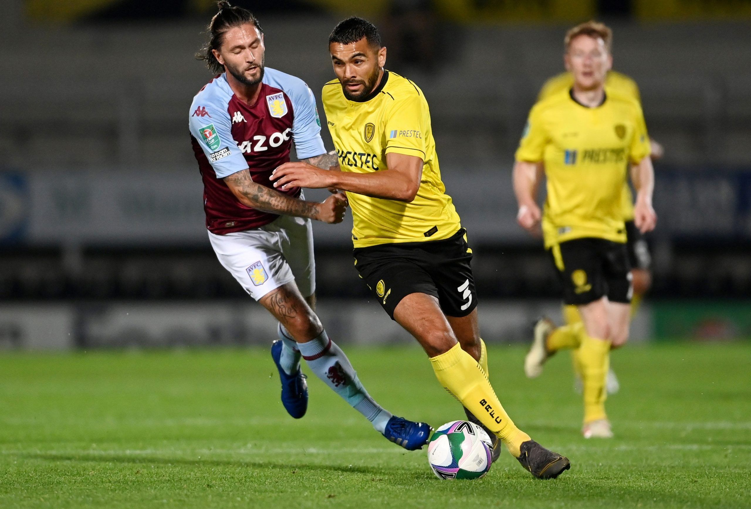 Soccer Football - Carabao Cup Second Round - Burton Albion v Aston Villa - Pirelli Stadium, Burton-on-Trent, Britain - September 15, 2020  Burton Albion's Colin Daniel in action with Aston Villa's Henri Lansbury   Pool via REUTERS/Laurence Griffiths  EDITORIAL USE ONLY. No use with unauthorized audio, video, data, fixture lists, club/league logos or 