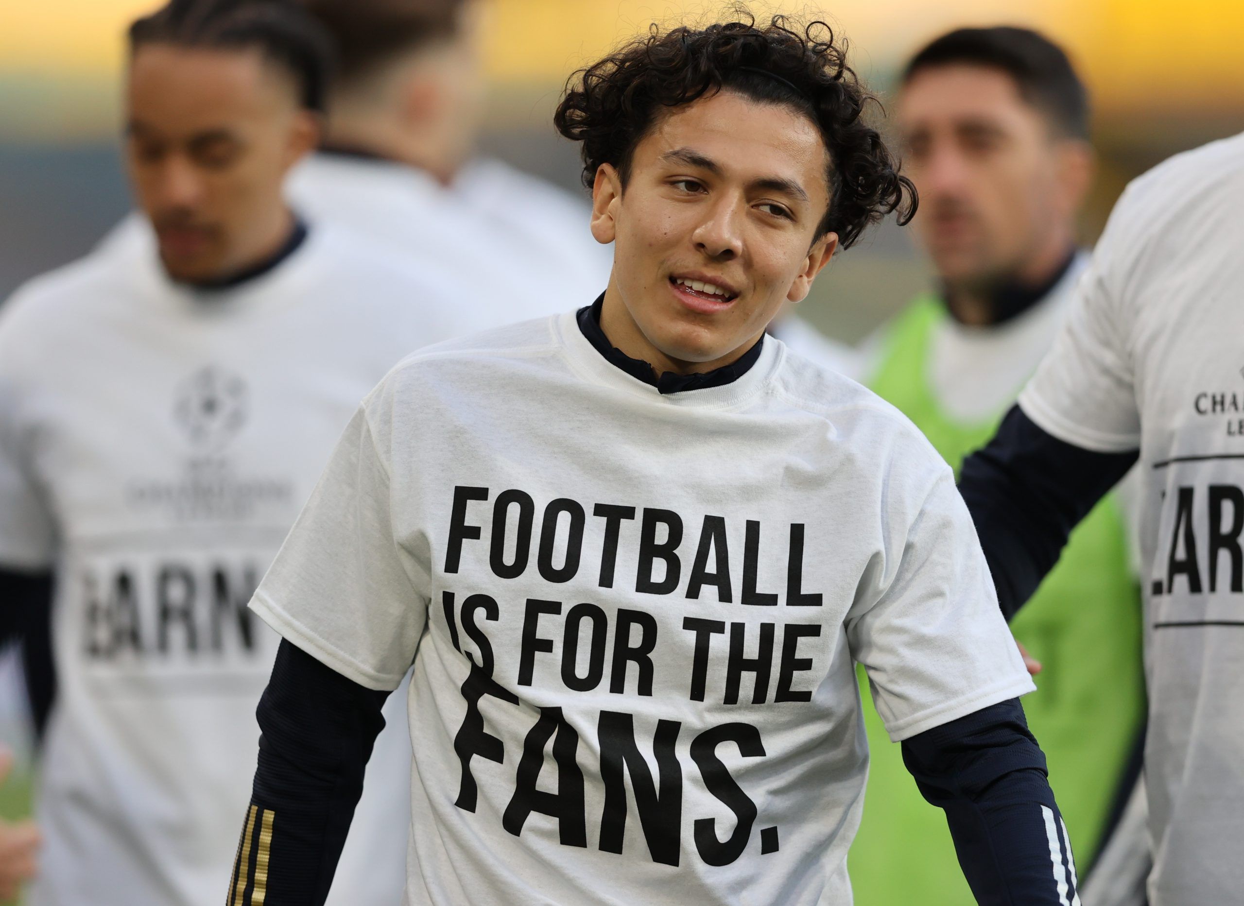 Soccer Football - Premier League - Leeds United v Liverpool - Elland Road, Leeds, Britain - April 19, 2021 Leeds United's Ian Poveda during the warm up before the match wearing UEFA Champions League T- Shirt with the message saying Football is for the Fans Pool via REUTERS/Clive Brunskill EDITORIAL USE ONLY. No use with unauthorized audio, video, data, fixture lists, club/league logos or 'live' services. Online in-match use limited to 75 images, no video emulation. No use in betting, games or si