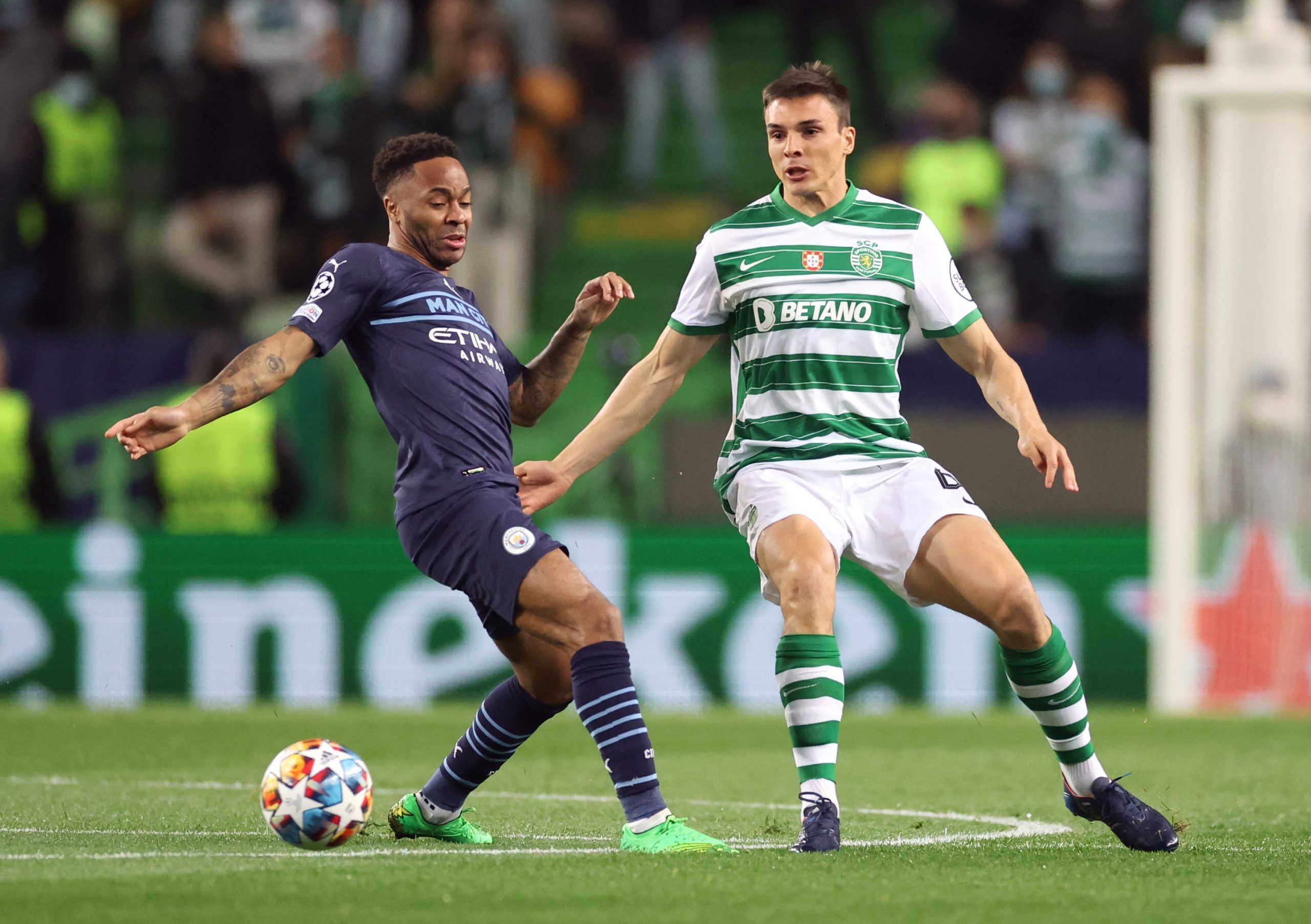 Soccer Football - Champions League - Round of 16 First Leg - Sporting CP v Manchester City - Estadio Jose Alvalade, Lisbon, Portugal - February 15, 2022 Manchester City's Raheem Sterling in action with Sporting CP's Joao Palhinha Action Images via Reuters/Carl Recine
