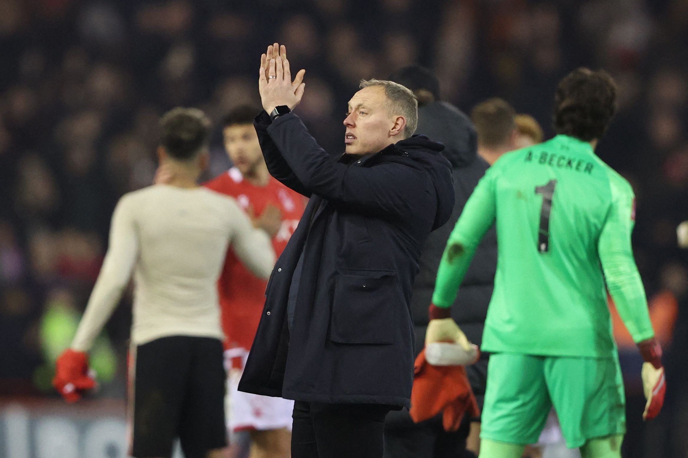 Soccer Football - FA Cup Quarter Final - Nottingham Forest v Liverpool - The City Ground, Nottingham, Britain - March 20, 2022 Nottingham Forest manager Steve Cooper applauds fans after the match Action Images via Reuters/Molly Darlington