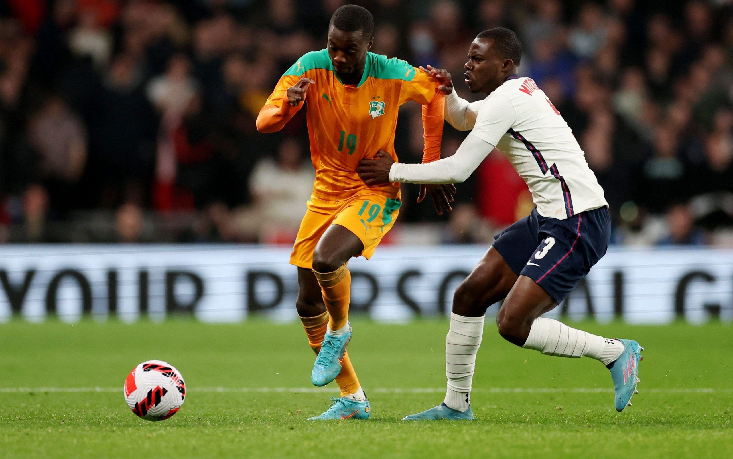 Soccer Football - International Friendly - England v Ivory Coast - Wembley Stadium, London, Britain - March 29, 2022  Ivory Coast's Nicolas Pepe in action with England's Tyrick Mitchell Action Images via Reuters/Carl Recine