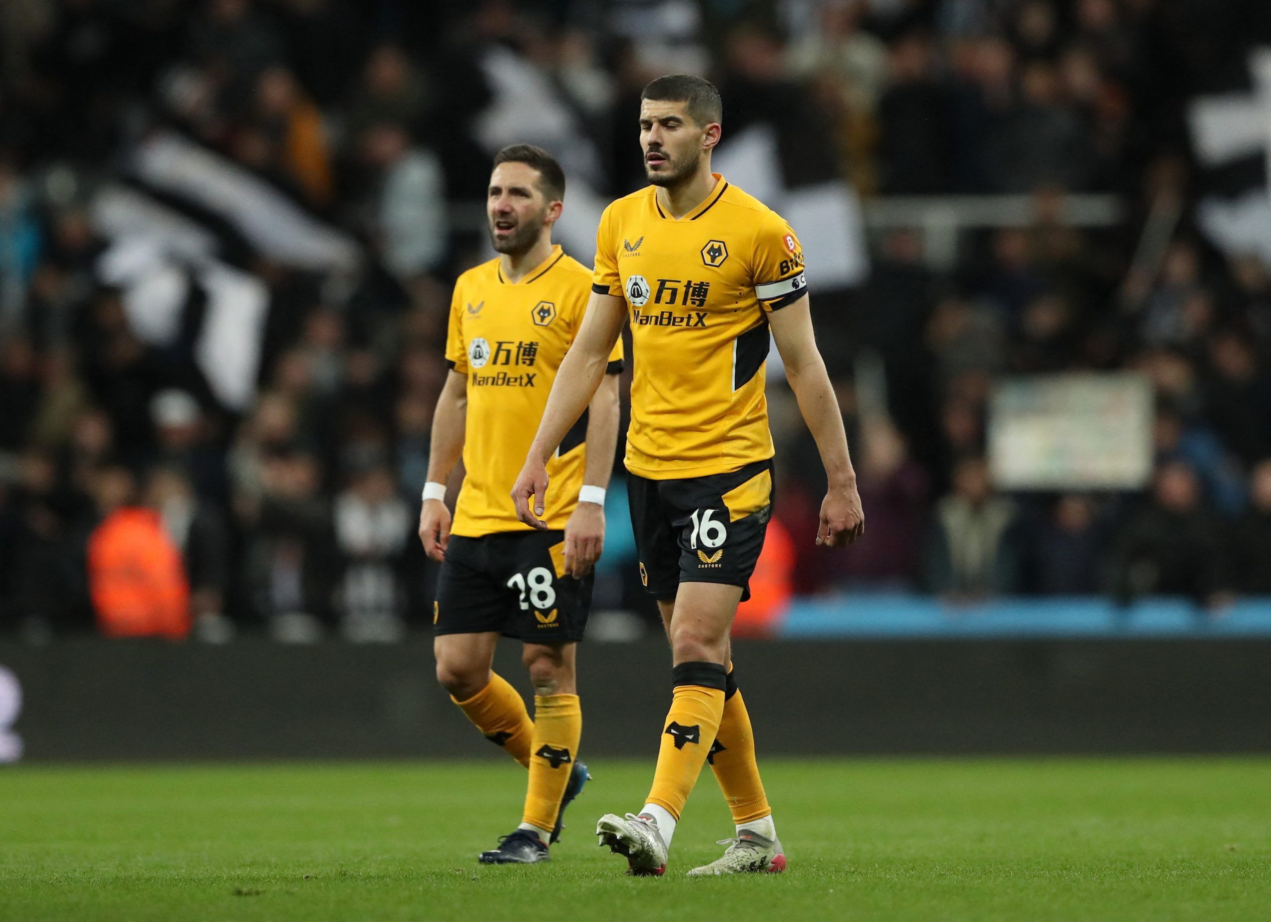 Soccer Football - Premier League - Newcastle United v Wolverhampton Wanderers - St James' Park, Newcastle, Britain - April 8, 2022  Wolverhampton Wanderers' Conor Coady and Joao Moutinho look dejected after the match REUTERS/Scott Heppell EDITORIAL USE ONLY. No use with unauthorized audio, video, data, fixture lists, club/league logos or 'live' services. Online in-match use limited to 75 images, no video emulation. No use in betting, games or single club /league/player publications.  Please cont