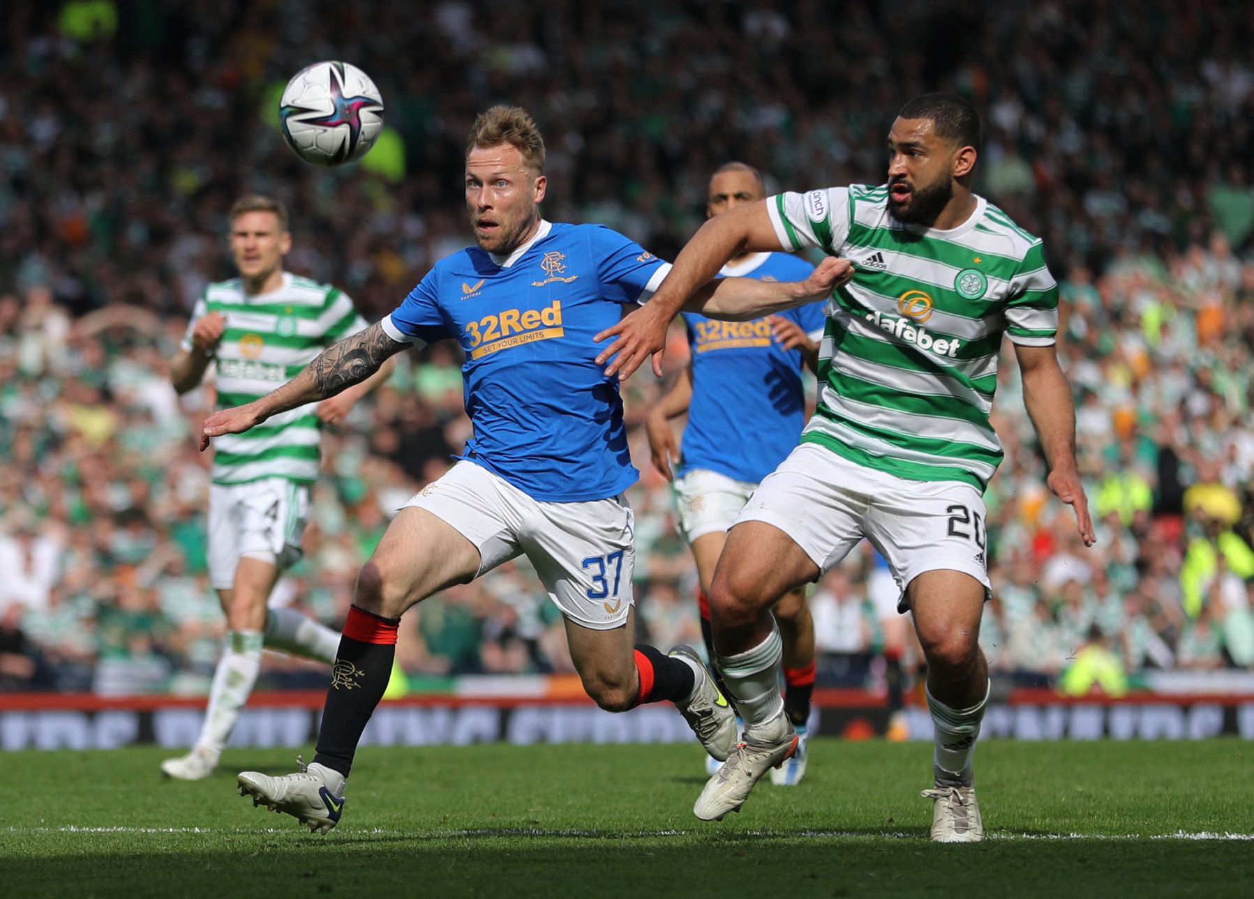 Soccer Football - Scottish Cup Semi Final - Celtic v Rangers - Hampden Park, Glasgow, Scotland, Britain - April 17, 2022 Rangers' Scott Arfield in action with Celtic's Cameron Carter-Vickers REUTERS/Russell Cheyne