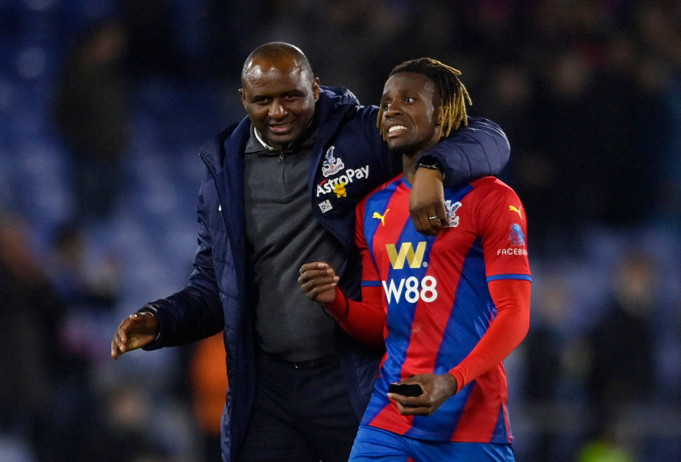 Crystal Palace manager Patrick Vieira and Wilfried Zaha after the matchSoccer Football - Premier League - Crystal Palace v Leeds United - Selhurst Park, London, Britain - April 25, 2022  Crystal Palace manager Patrick Vieira and Wilfried Zaha after the match REUTERS/Tony Obrien EDITORIAL USE ONLY. No use with unauthorized audio, video, data, fixture lists, club/league logos or 'live' services. Online in-match use limited to 75 images, no video emulation. No use in betting, games or single club /