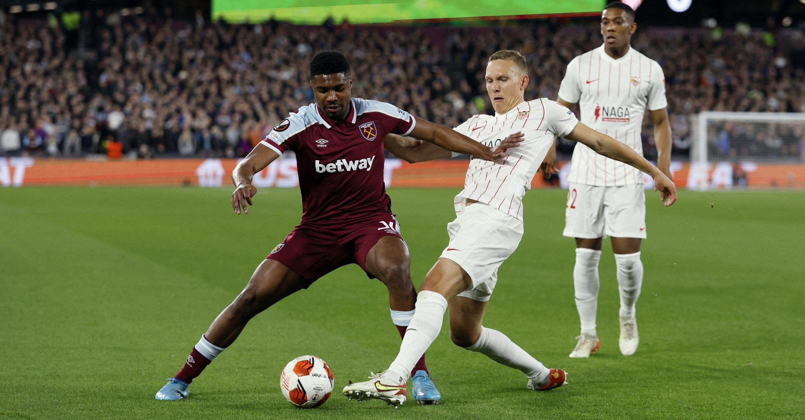 Soccer Football - Europa League - Round of 16 Second Leg - West Ham United v Sevilla - London Stadium, London, Britain - March 17, 2022  West Ham United's Ben Johnson in action with Sevilla's Ludwig Augustinsson Action Images via Reuters/Andrew Couldridge