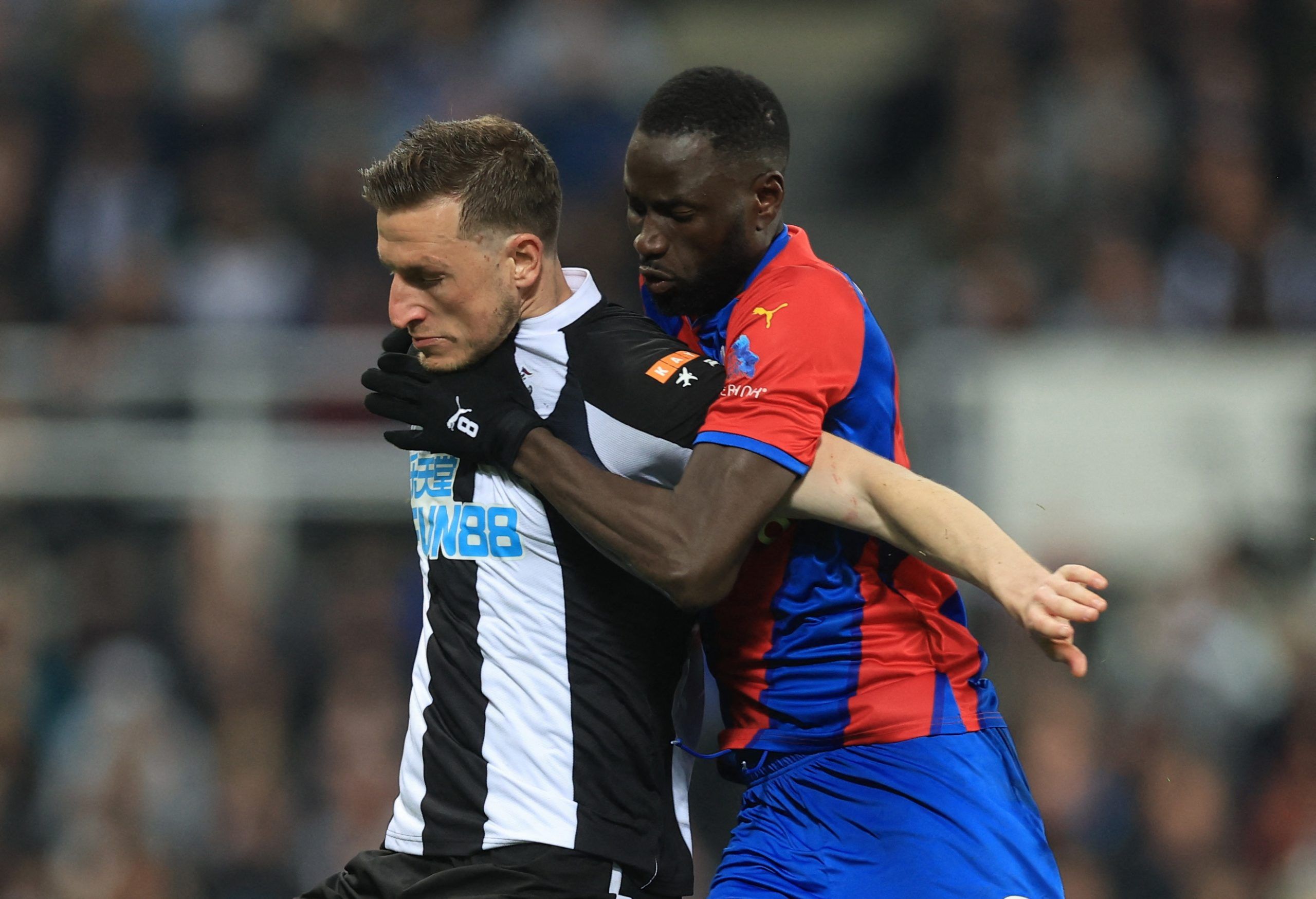 Newcastle United v Crystal Palace - St James' Park, Newcastle, Britain - April 20, 2022 Crystal Palace's Cheikhou Kouyate in action with Newcastle United's Chris Wood Action Images via Reuters/Lee Smith