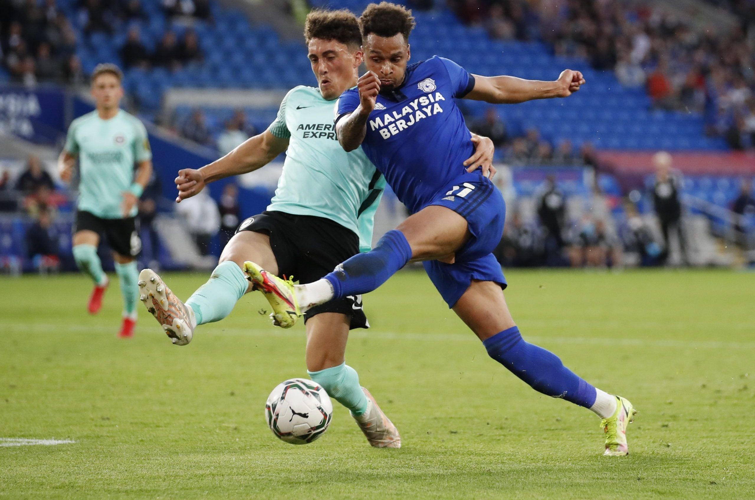 Soccer - England - Carabao Cup Second Round - Cardiff City v Brighton &amp; Hove Albion - Cardiff City Stadium, Cardiff, Britain - August 24, 2021 Cardiff City's Josh Murphy in action with Brighton &amp; Hove Albion's Haydon Roberts Action Images via Reuters/Peter Cziborra