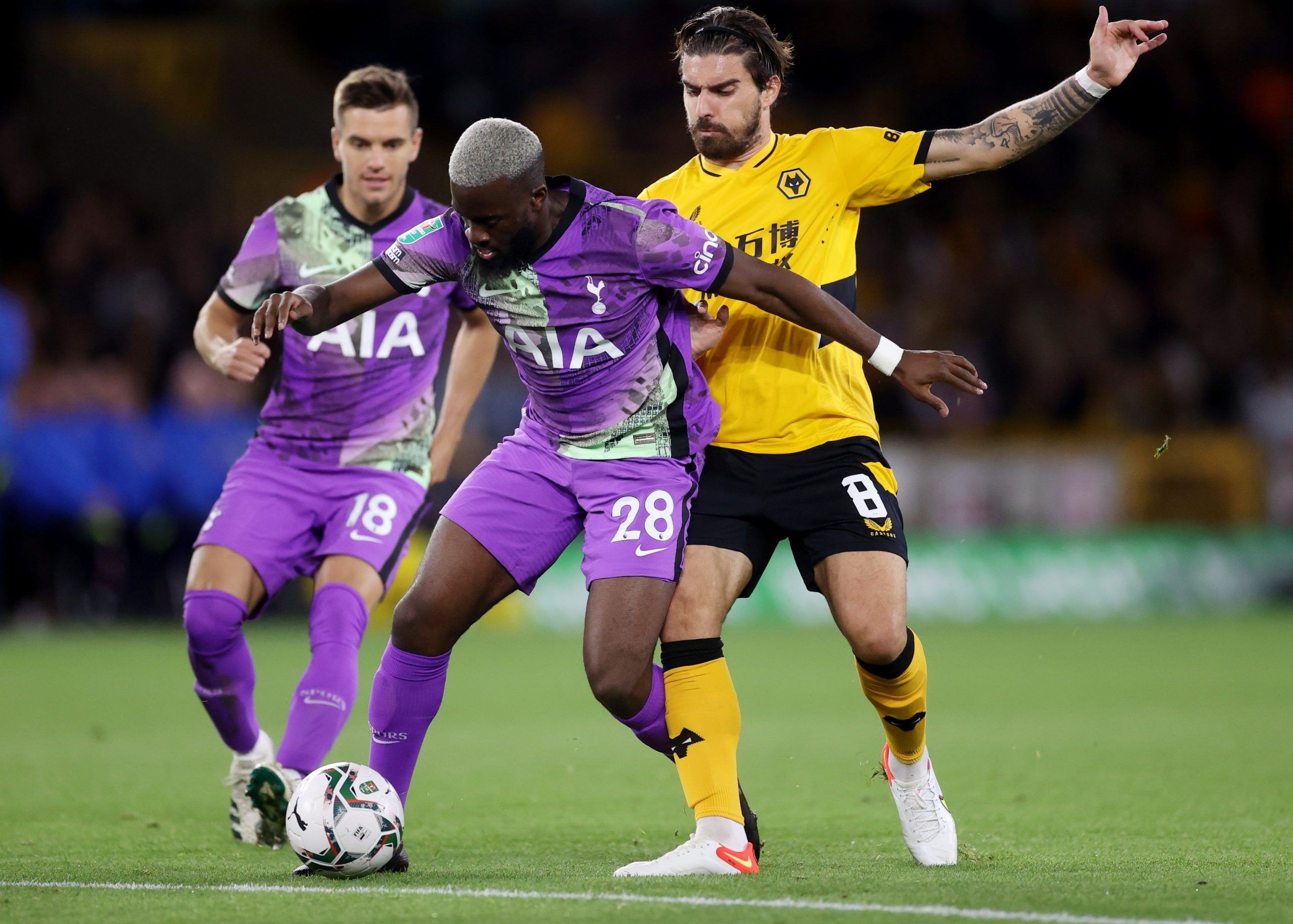 Soccer Football - Carabao Cup - Third Round - Wolverhampton Wanderers v Tottenham Hotspur - Molineux Stadium, Wolverhampton, Britain - September 22, 2021 Tottenham Hotspur's Tanguy Ndombele in action with Wolverhampton Wanderers' Ruben Neves Action Images via Reuters/Carl Recine EDITORIAL USE ONLY. No use with unauthorized audio, video, data, fixture lists, club/league logos or 'live' services. Online in-match use limited to 75 images, no video emulation. No use in betting, games or single club 