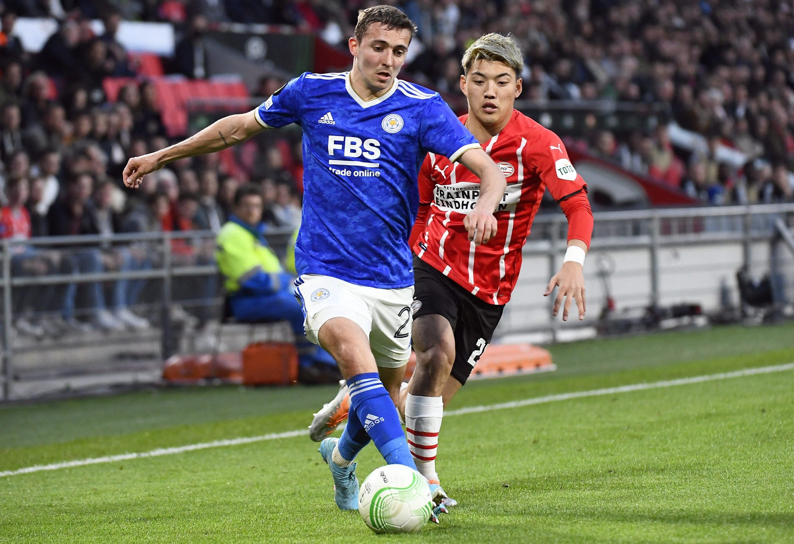 Soccer Football - Europa Conference League - Quarter Final - Second Leg - PSV Eindhoven v Leicester City - Philips Stadion, Eindhoven, Netherlands - April 14, 2022 Leicester City's Timothy Castagne in action with PSV Eindhoven's Ritsu Doan REUTERS/Piroschka Van De Wouw