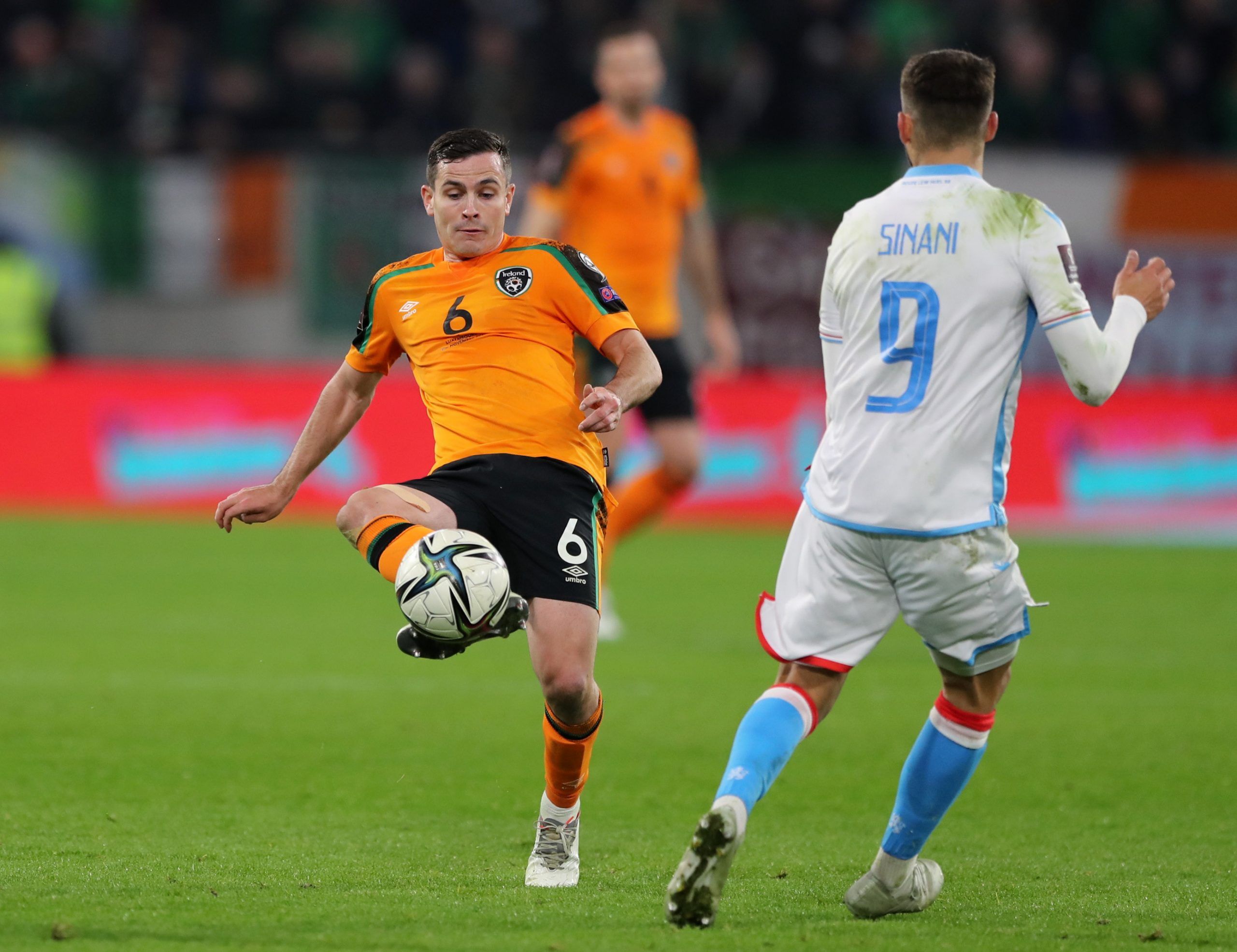 Soccer Football - World Cup - UEFA Qualifiers - Group A - Luxembourg v Republic of Ireland - Stade de Luxembourg, Luxembourg City, Luxembourg - November 14, 2021  Republic of Ireland's Josh Cullen in action with Luxembourg's Daniel Sinani REUTERS/Pascal Rossignol