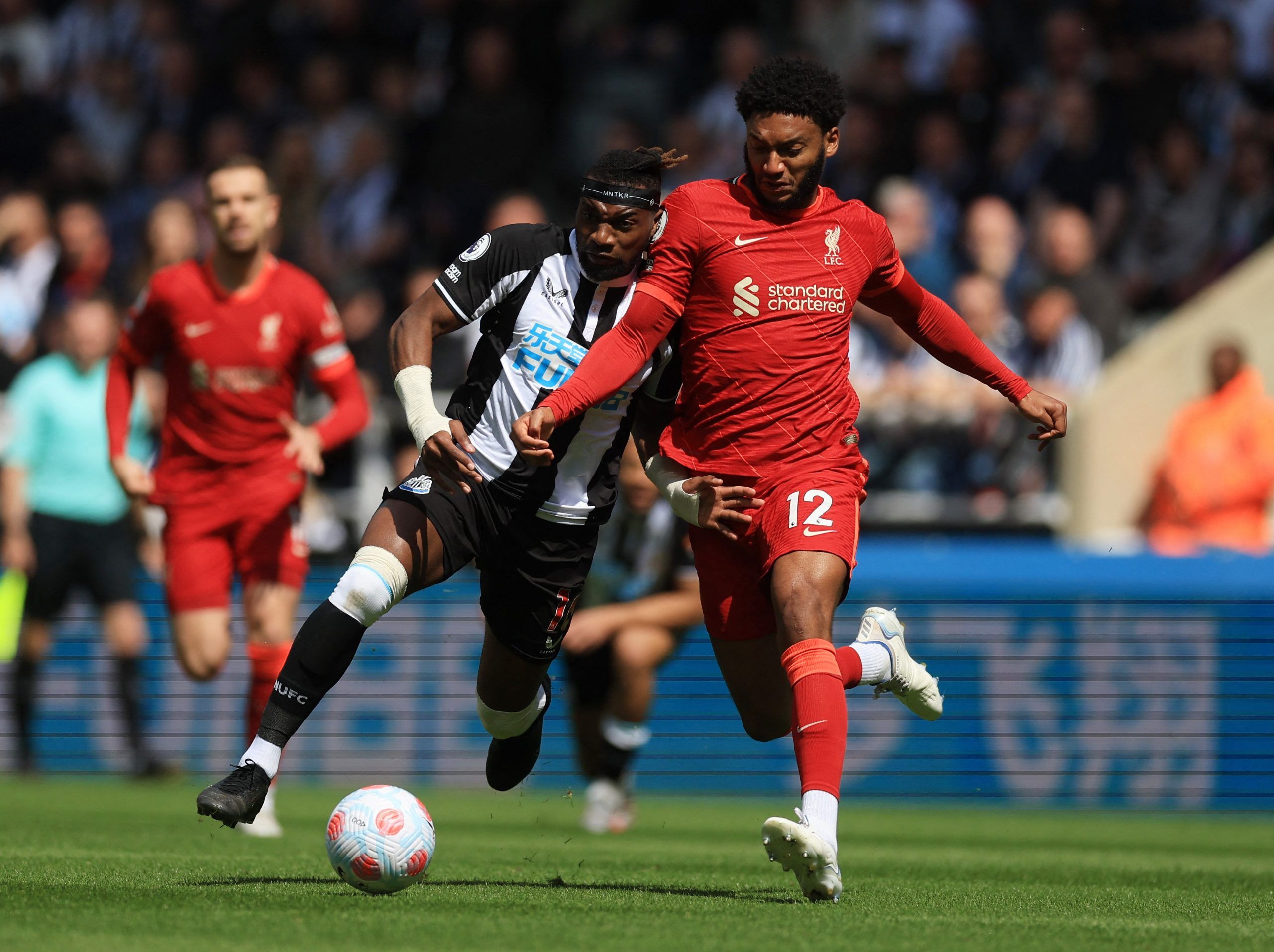 Soccer Football - Premier League - Newcastle United v Liverpool - St James' Park, Newcastle, Britain - April 30, 2022 Newcastle United's Allan Saint-Maximin in action with Liverpool's Joe Gomez Action Images via Reuters/Lee Smith EDITORIAL USE ONLY. No use with unauthorized audio, video, data, fixture lists, club/league logos or 'live' services. Online in-match use limited to 75 images, no video emulation. No use in betting, games or single club /league/player publications.  Please contact your 
