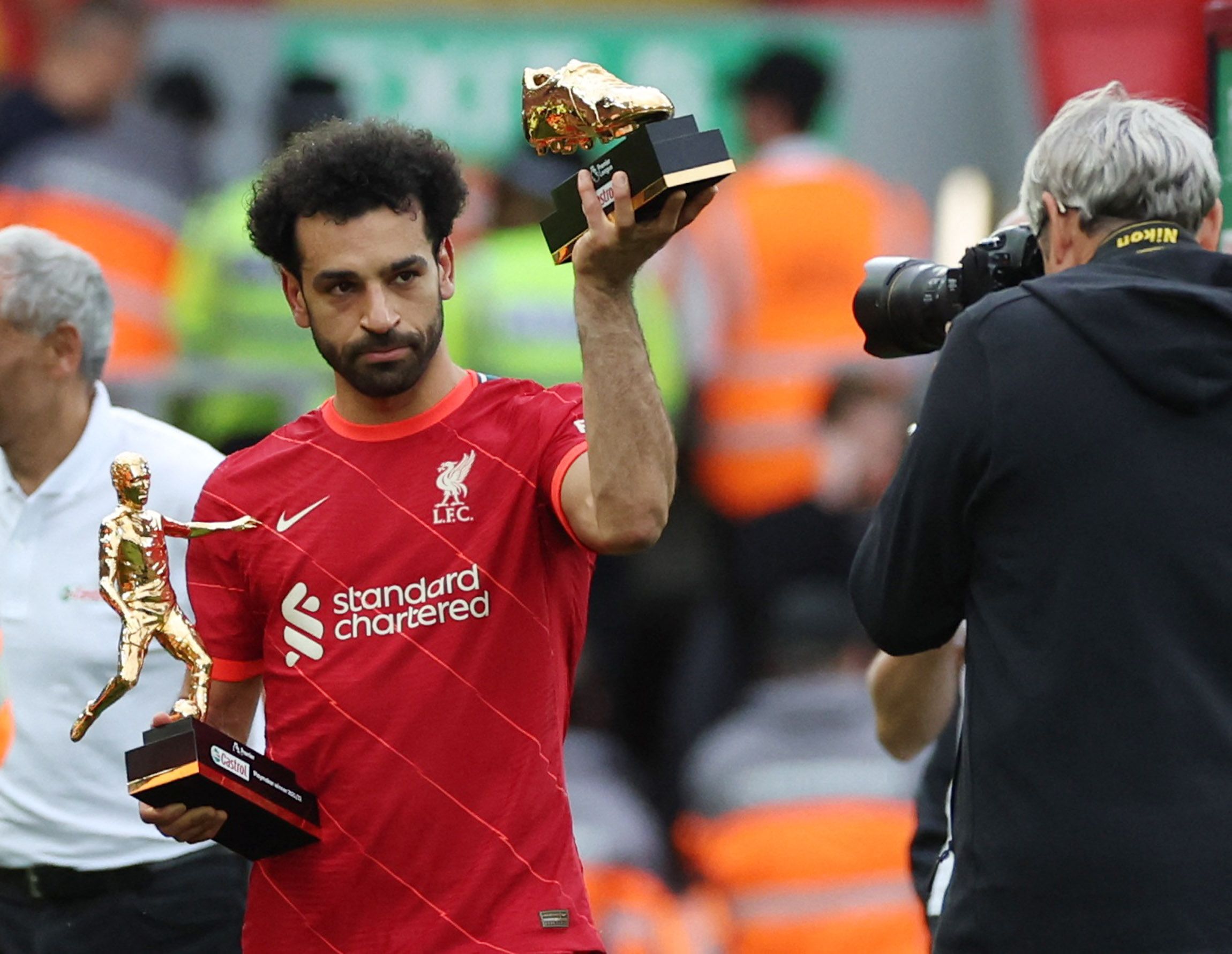 Soccer Football - Premier League - Liverpool v Wolverhampton Wanderers - Anfield, Liverpool, Britain - May 22, 2022 Liverpool's Mohamed Salah holding the Premier League Playmaker and Golden Boot winner trophies after the match REUTERS/Phil Noble EDITORIAL USE ONLY. No use with unauthorized audio, video, data, fixture lists, club/league logos or 'live' services. Online in-match use limited to 75 images, no video emulation. No use in betting, games or single club /league/player publications.  Plea
