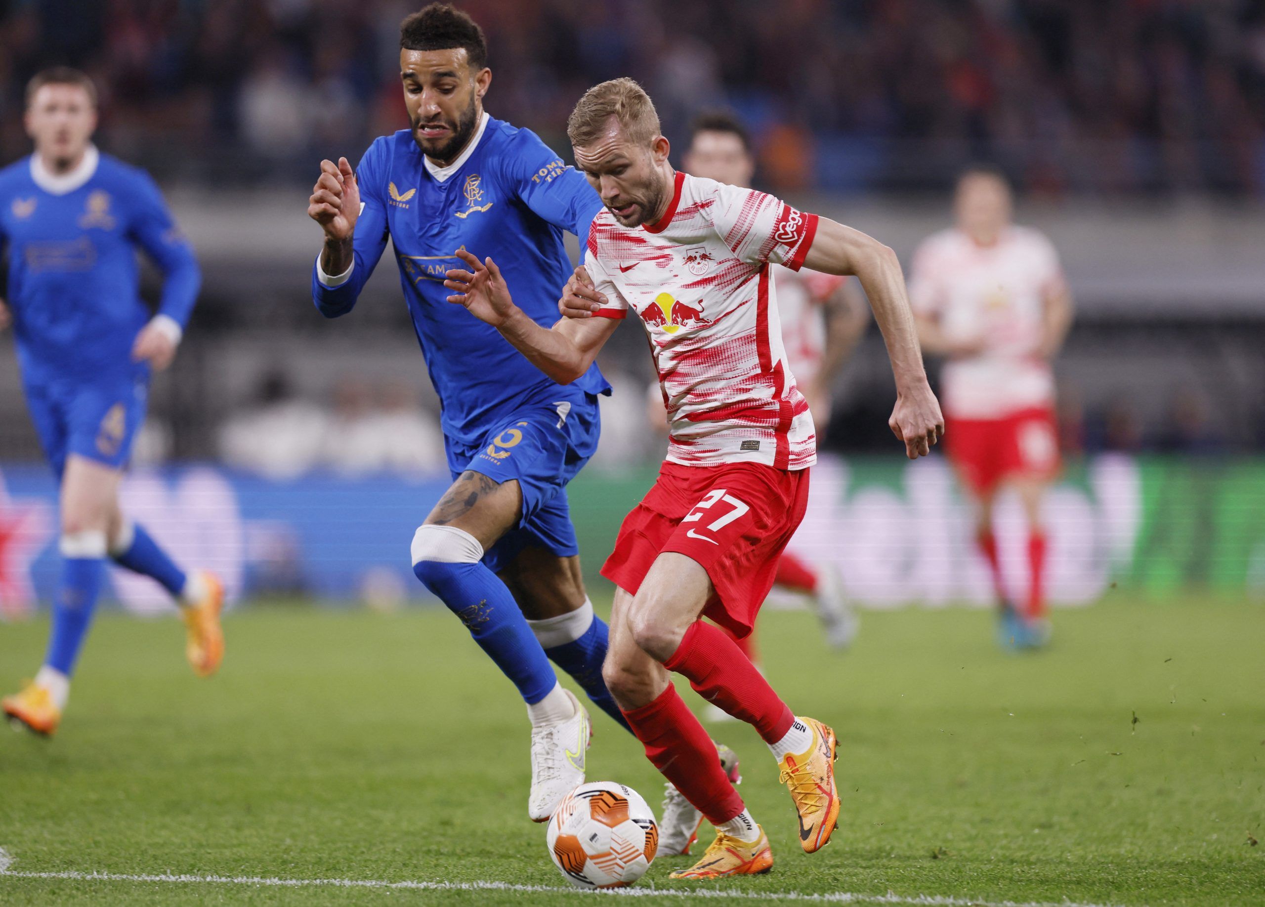 Soccer Football - Europa League - Semi Final - First Leg - RB Leipzig v Rangers - Red Bull Arena, Leipzig, Germany - April 28, 2022 Rangers' Connor Goldson in action with RB Leipzig's Konrad Laimer Action Images via Reuters/Andrew Couldridge