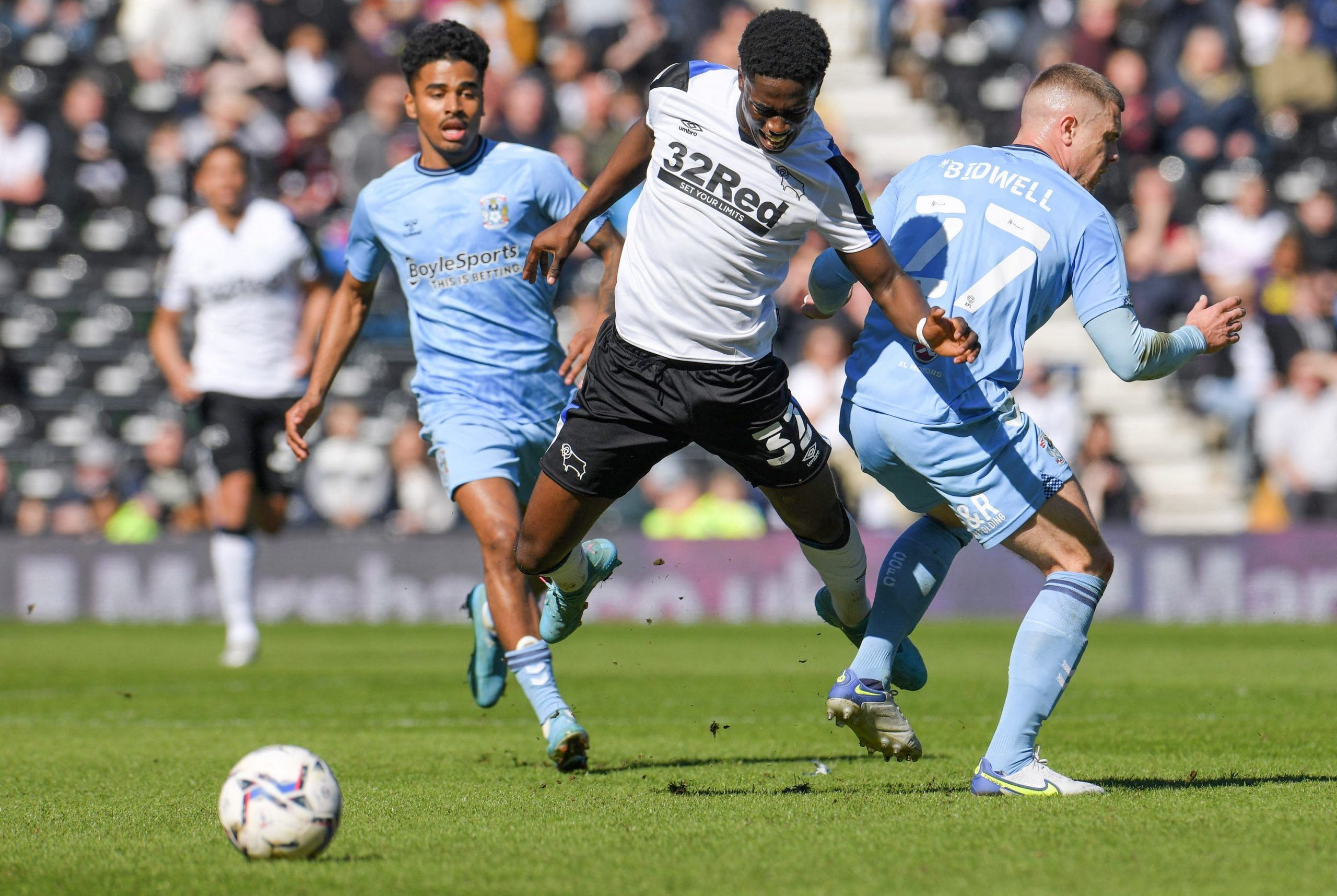 Soccer Football - Championship - Derby County v Coventry City - Pride Park, Derby, Britain - March 19, 2022 Derby County's Malcolm Ebiowei in action with Coventry City's Jake Bidwell Action Images/Paul Burrows  EDITORIAL USE ONLY. No use with unauthorized audio, video, data, fixture lists, club/league logos or 