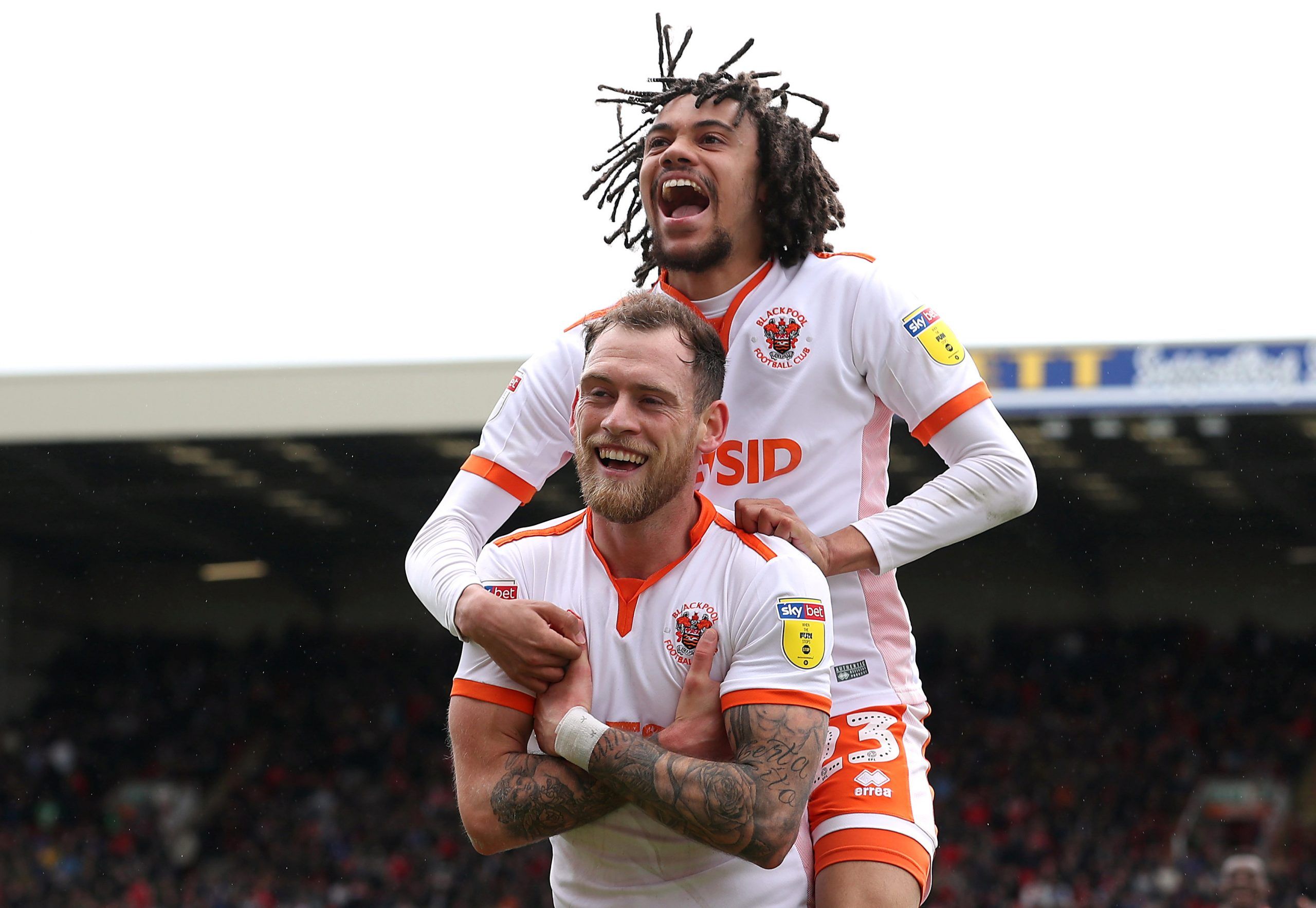 Soccer Football - League One - Barnsley v Blackpool - Oakwell, Barnsley, Britain - April 27, 2019   Blackpool's Harry Pritchard celebrates scoring their first goal with Nya Kirby   Action Images/John Clifton    EDITORIAL USE ONLY. No use with unauthorized audio, video, data, fixture lists, club/league logos or 