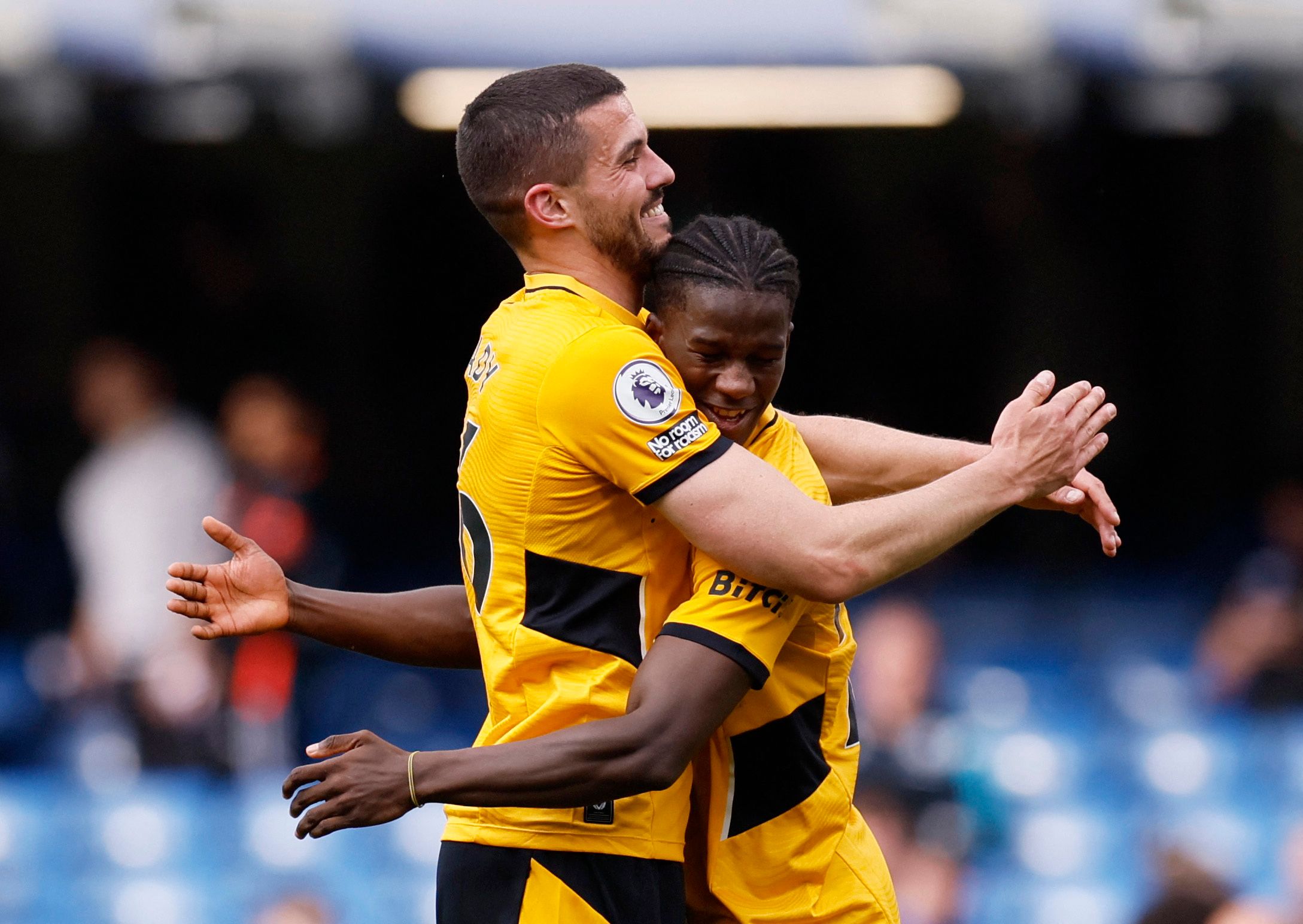 Soccer Football - Premier League - Chelsea v Wolverhampton Wanderers - Stamford Bridge, London, Britain - May 7, 2022 Wolverhampton Wanderers' Conor Coady celebrates with Chiquinho after the match Action Images via Reuters/Andrew Couldridge EDITORIAL USE ONLY. No use with unauthorized audio, video, data, fixture lists, club/league logos or 'live' services. Online in-match use limited to 75 images, no video emulation. No use in betting, games or single club /league/player publications.  Please co