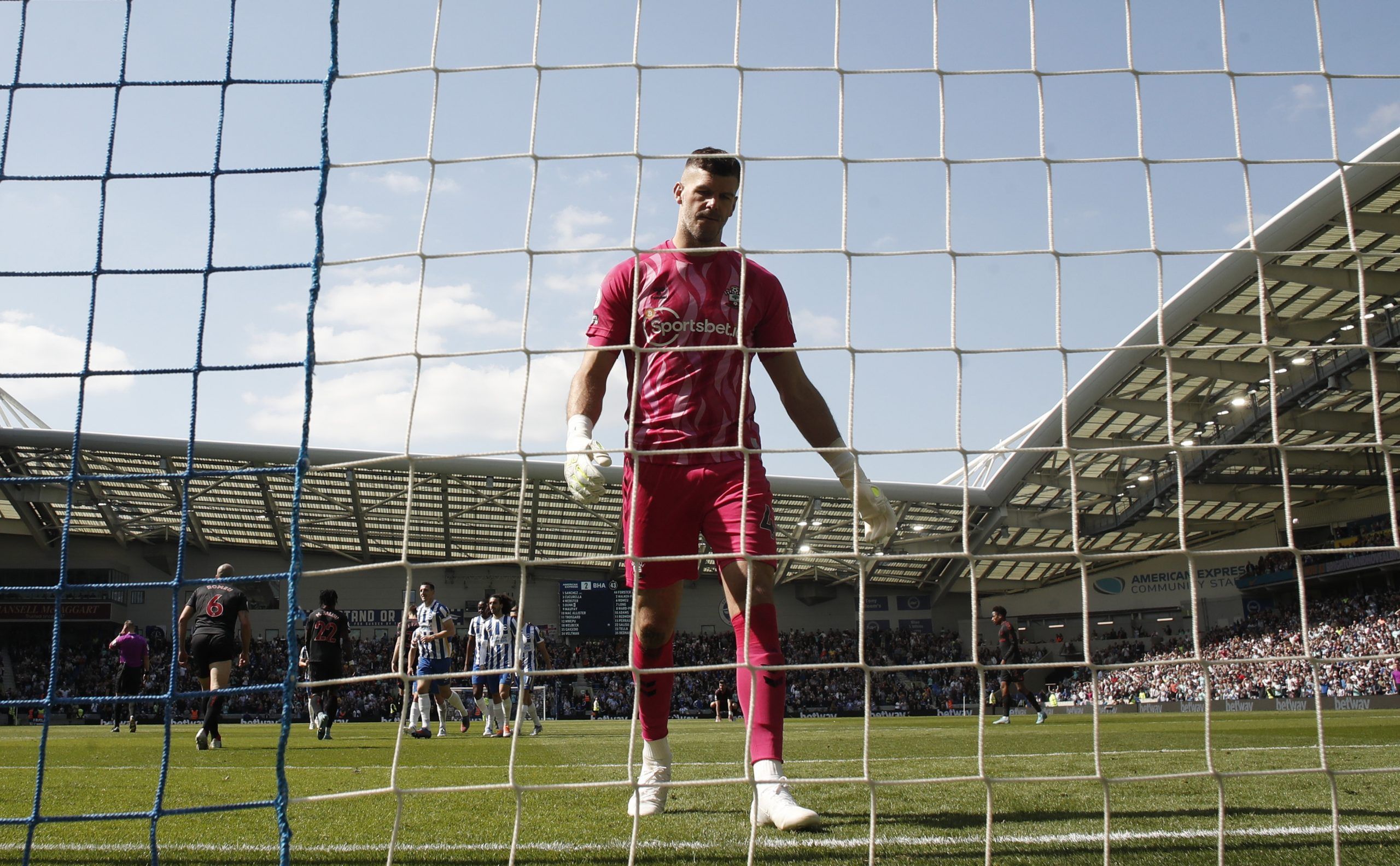 Soccer Football - Premier League - Brighton &amp; Hove Albion v Southampton - The American Express Community Stadium, Brighton, Britain - April 24, 2022  Southampton's Fraser Forster reacts after Brighton &amp; Hove Albion scored their second goal an own goal scored by Mohammed Salisu Action Images via Reuters/Andrew Couldridge EDITORIAL USE ONLY. No use with unauthorized audio, video, data, fixture lists, club/league logos or 'live' services. Online in-match use limited to 75 images, no video e