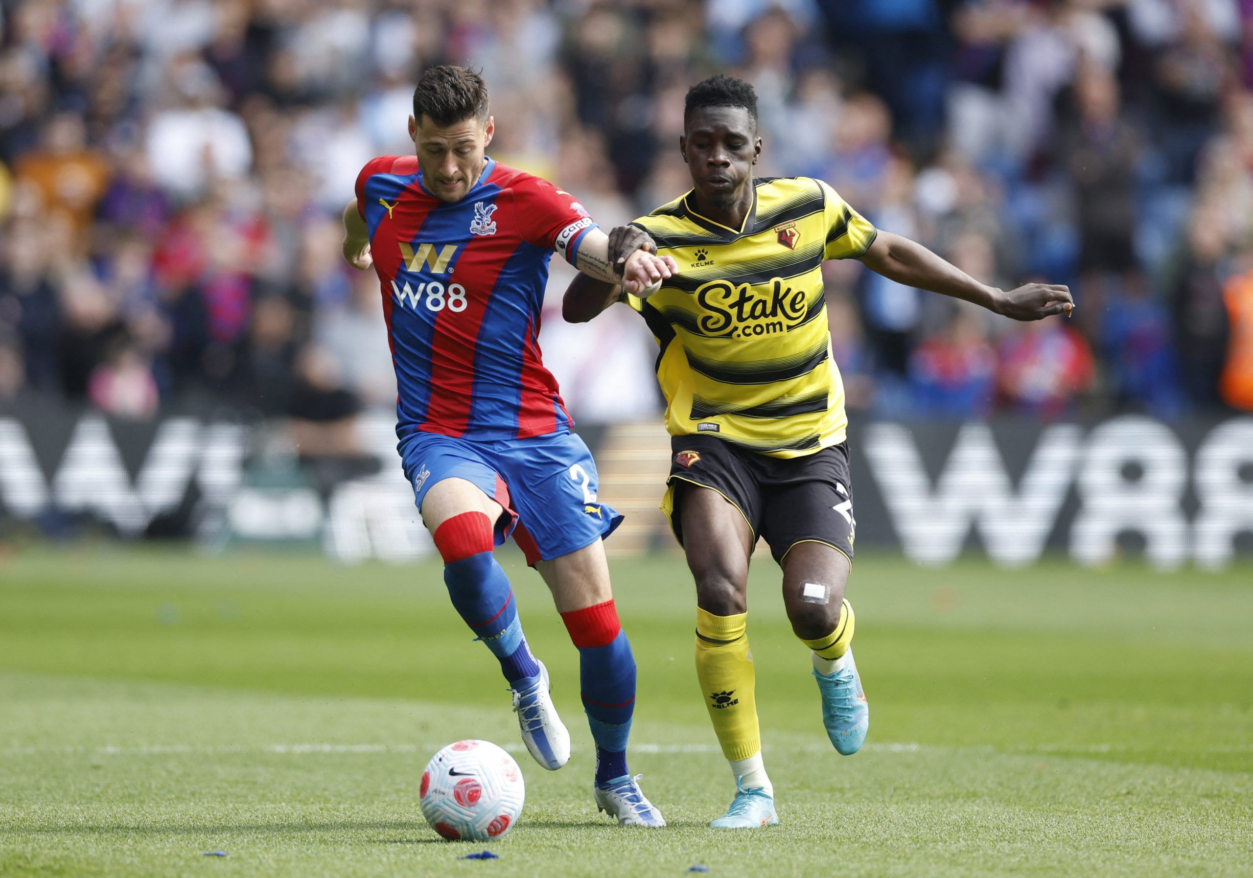Soccer Football - Premier League - Crystal Palace v Watford - Selhurst Park, London, Britain - May 7, 2022 Crystal Palace's Joel Ward in action with Watford's Ismaila Sarr Action Images via Reuters/Peter Cziborra EDITORIAL USE ONLY. No use with unauthorized audio, video, data, fixture lists, club/league logos or 'live' services. Online in-match use limited to 75 images, no video emulation. No use in betting, games or single club /league/player publications.  Please contact your account represent