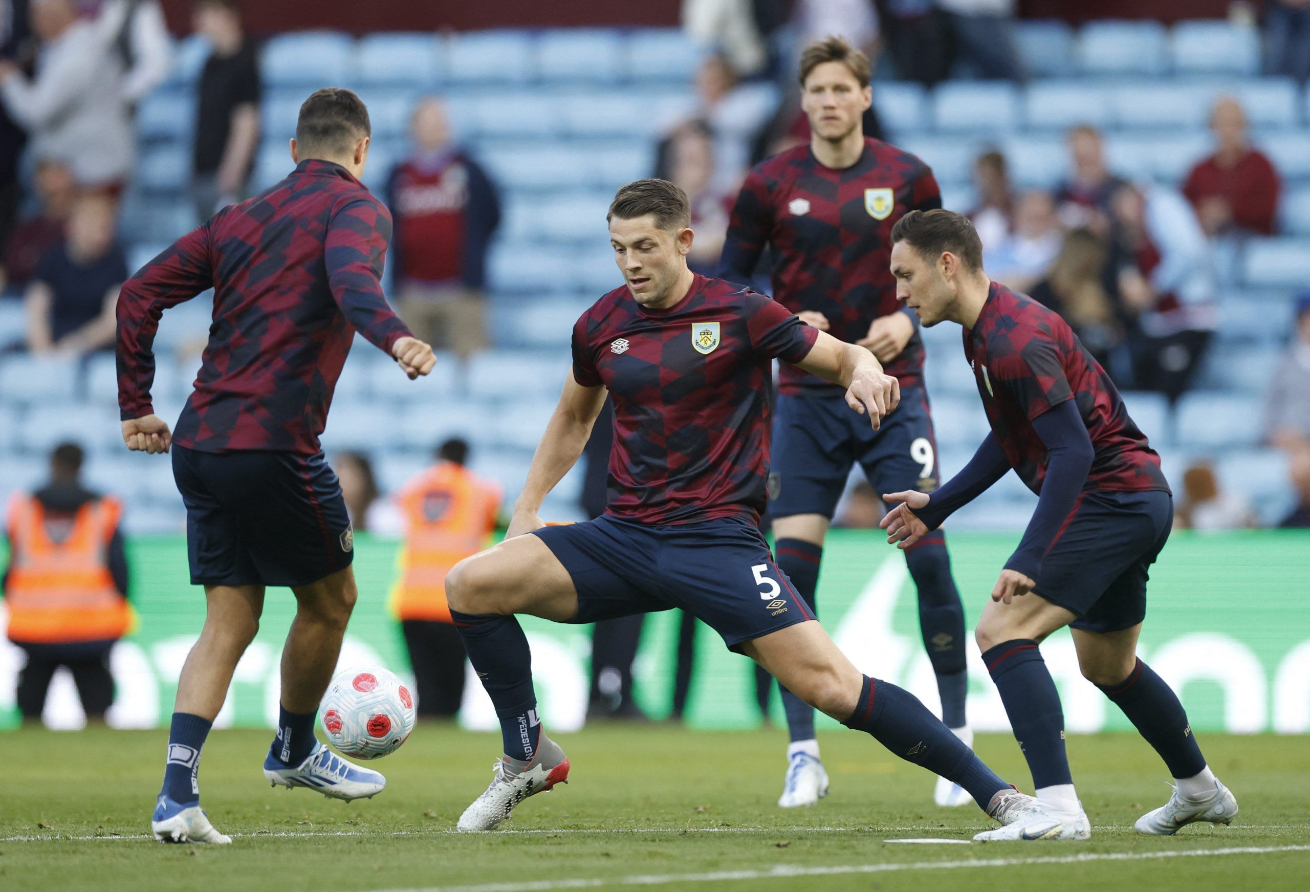 Soccer Football - Premier League - Aston Villa v Burnley - Villa Park, Birmingham, Britain - May 19, 2022 Burnley's James Tarkowski  with teammates during the warm up before the match Action Images via Reuters/Peter Cziborra EDITORIAL USE ONLY. No use with unauthorized audio, video, data, fixture lists, club/league logos or 'live' services. Online in-match use limited to 75 images, no video emulation. No use in betting, games or single club /league/player publications.  Please contact your accou