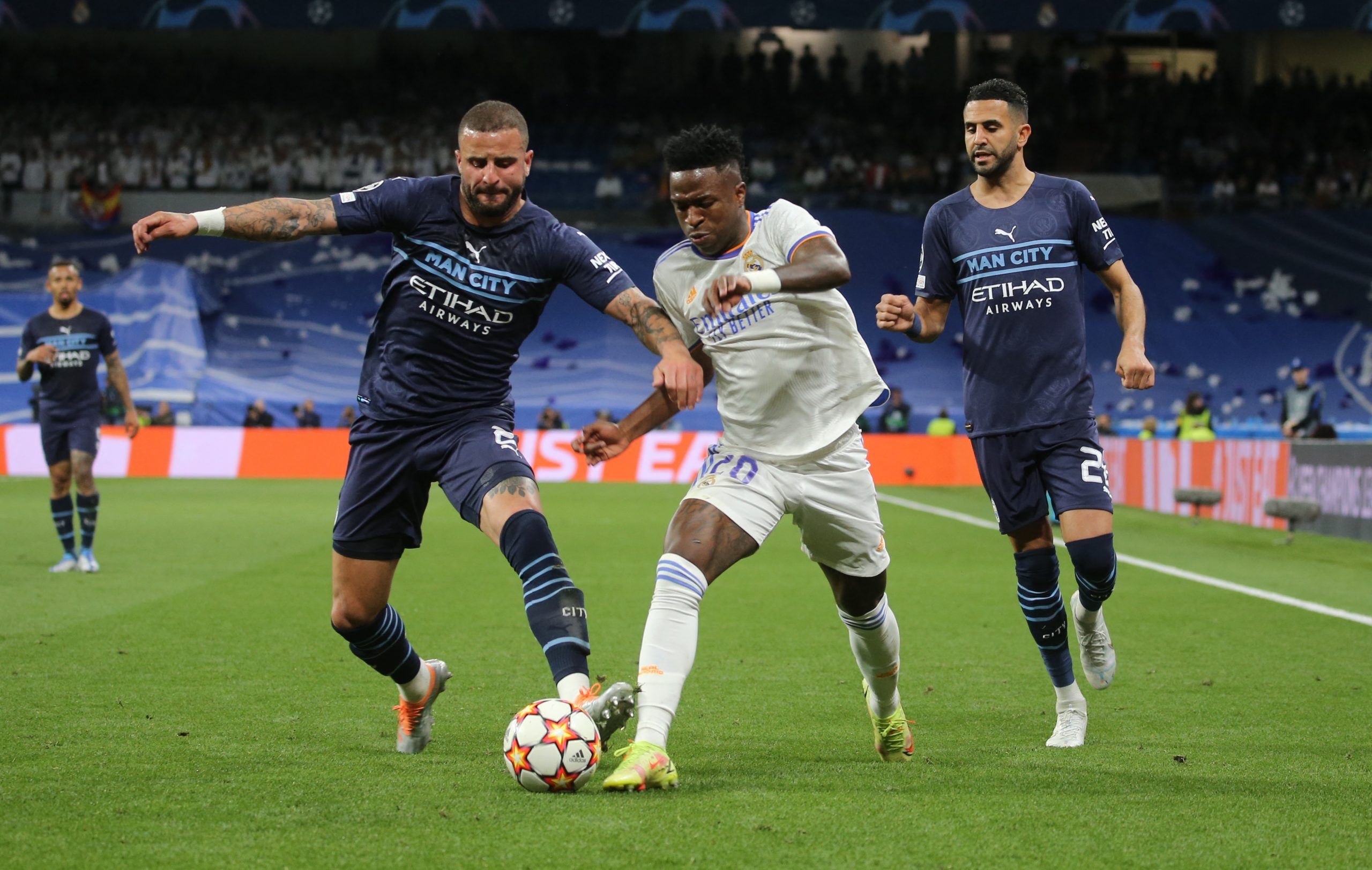 Soccer Football - Champions League - Semi Final - Second Leg - Real Madrid v Manchester City - Santiago Bernabeu, Madrid, Spain - May 4, 2022 Real Madrid's Vinicius Junior in action with Manchester City's Kyle Walker REUTERS/Isabel Infantes