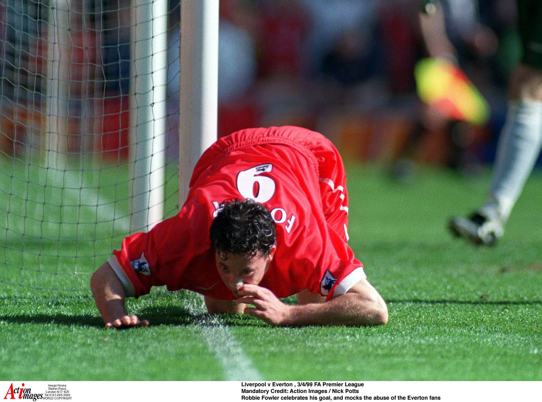 Football - Liverpool v Everton - FA Premier League 98/99 - Anfield 3/4/99 
Robbie Fowler celebrates after scoring a goal for Liverpool goal, and mocks the abuse of the Everton fans infamous alleged 