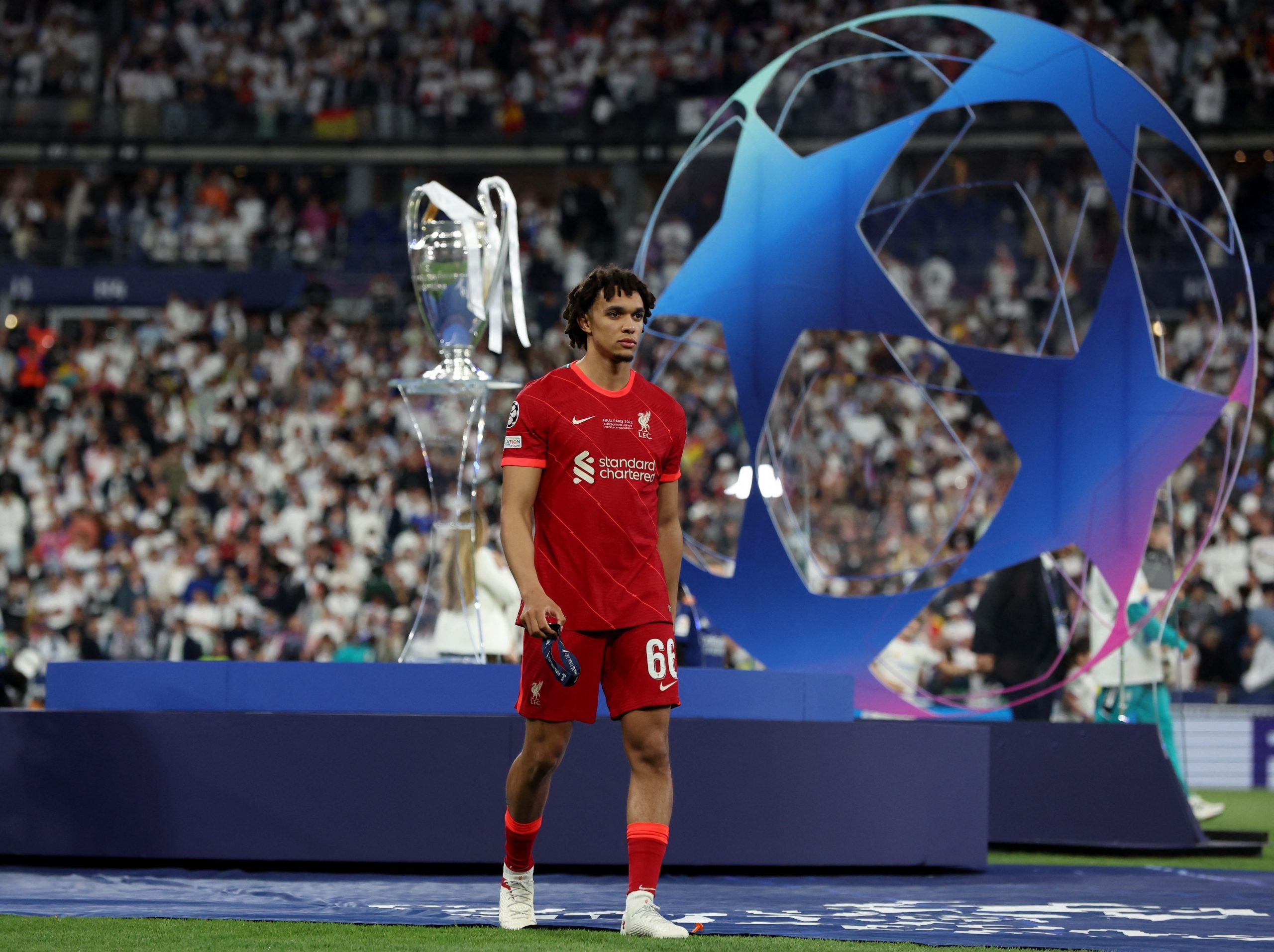 Soccer Football - Champions League Final - Liverpool v Real Madrid - Stade de France, Saint-Denis near Paris, France - May 28, 2022 Liverpool's Trent Alexander-Arnold looks dejected as he walks past the trophy and collects his runners up medal after the match REUTERS/Lee Smith