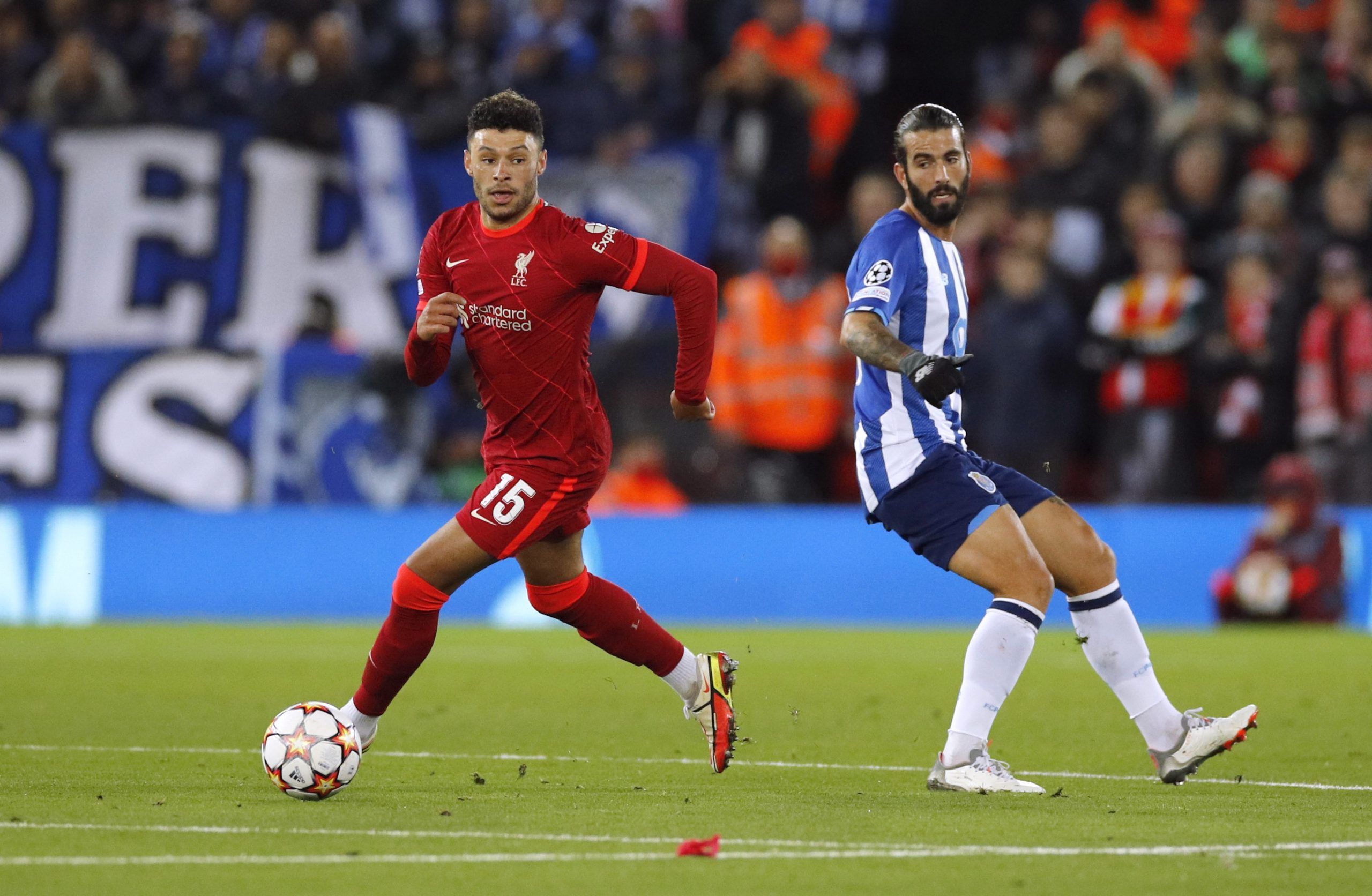 Soccer Football - Champions League - Group B - Liverpool v FC Porto - Anfield, Liverpool, Britain - November 24, 2021 Liverpool's Alex Oxlade-Chamberlain in action with FC Porto's Sergio Oliveira REUTERS/Phil Noble