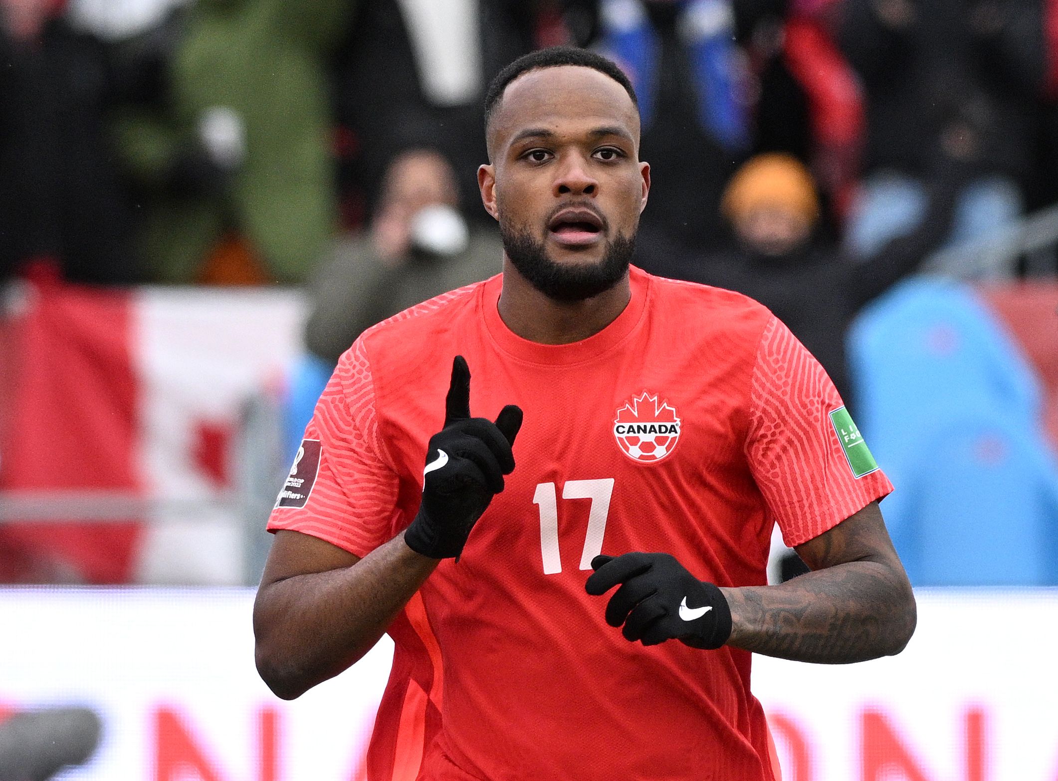 Mar 27, 2022; Toronto, Ontario, CAN;  Canada forward Cyle Larin (17) gestures as he celebrates scoring a goal against Jamaica in the first half of a FIFA World Cup qualifying soccer match at BMO Field. Mandatory Credit: Dan Hamilton-USA TODAY Sports