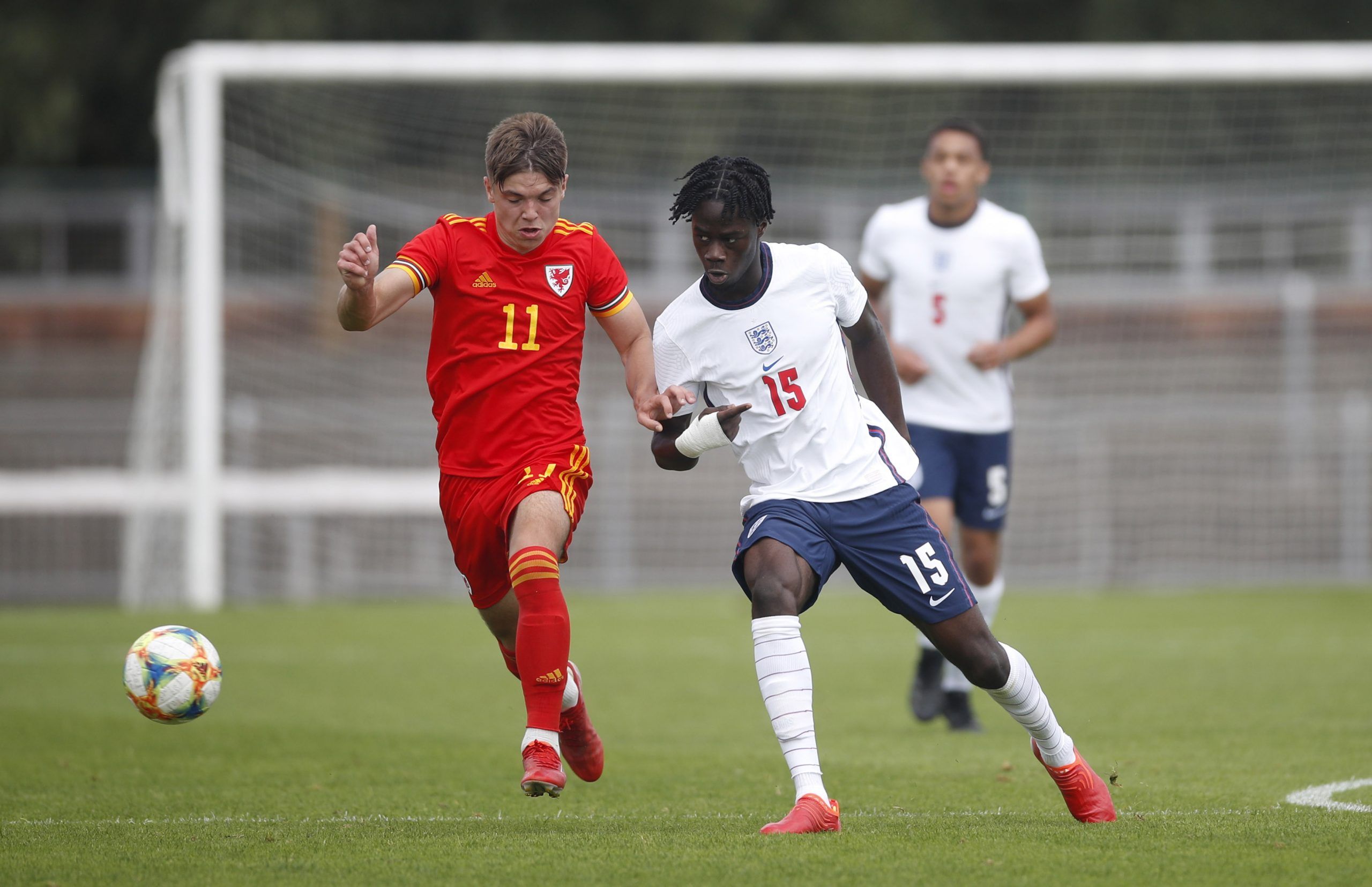 Soccer Football - Under 18 International Friendly - Wales v England - Spytty Park, Newport, Wales Britain - September 3, 2021 Wales’ Cian Ashford in action with England's Darko Gyabi Action Images/Matthew Childs